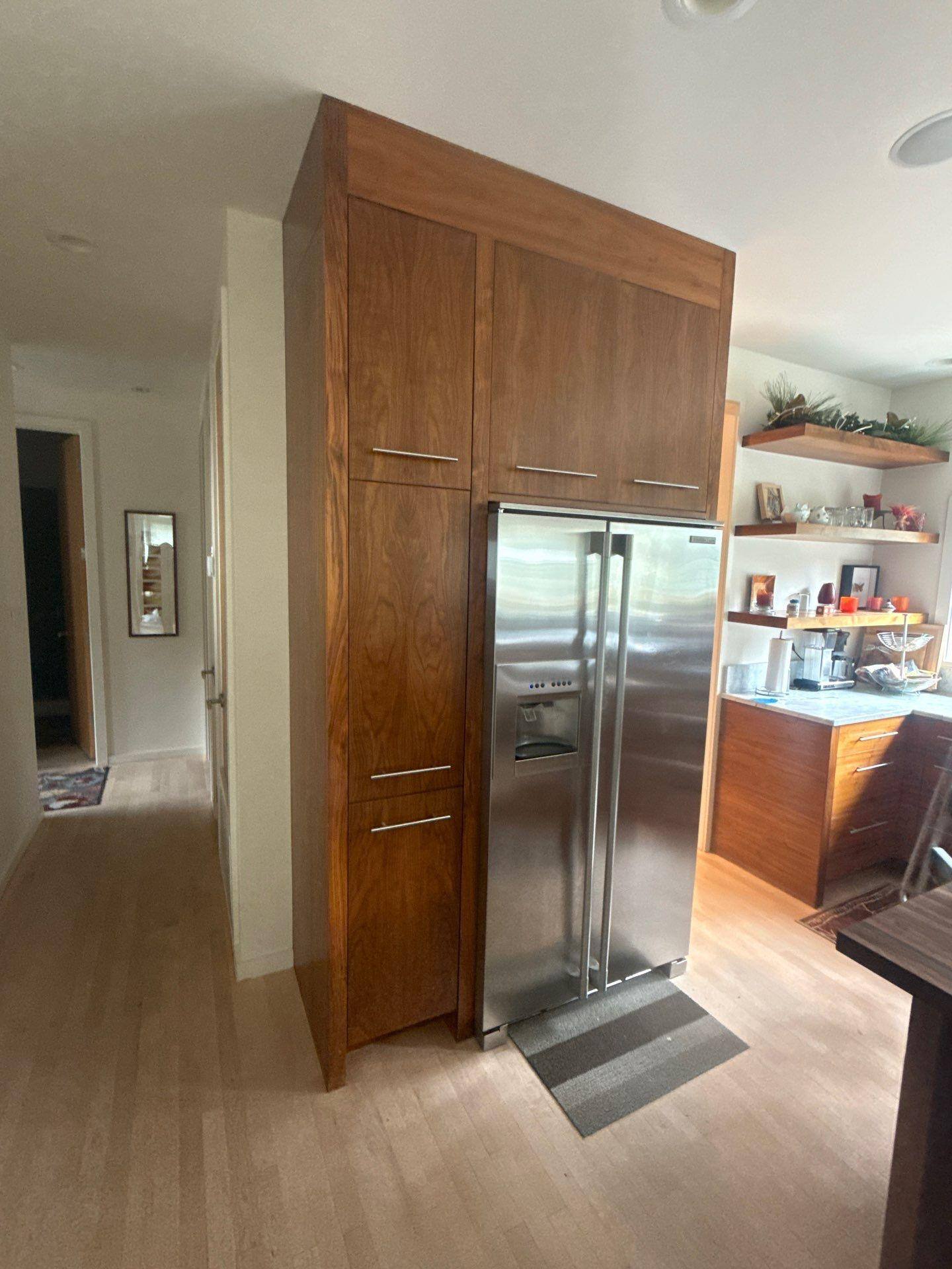 Kitchen cabinetry of a home in Austin, TX ahead of cabinet refinishing by Hill Country Painting
