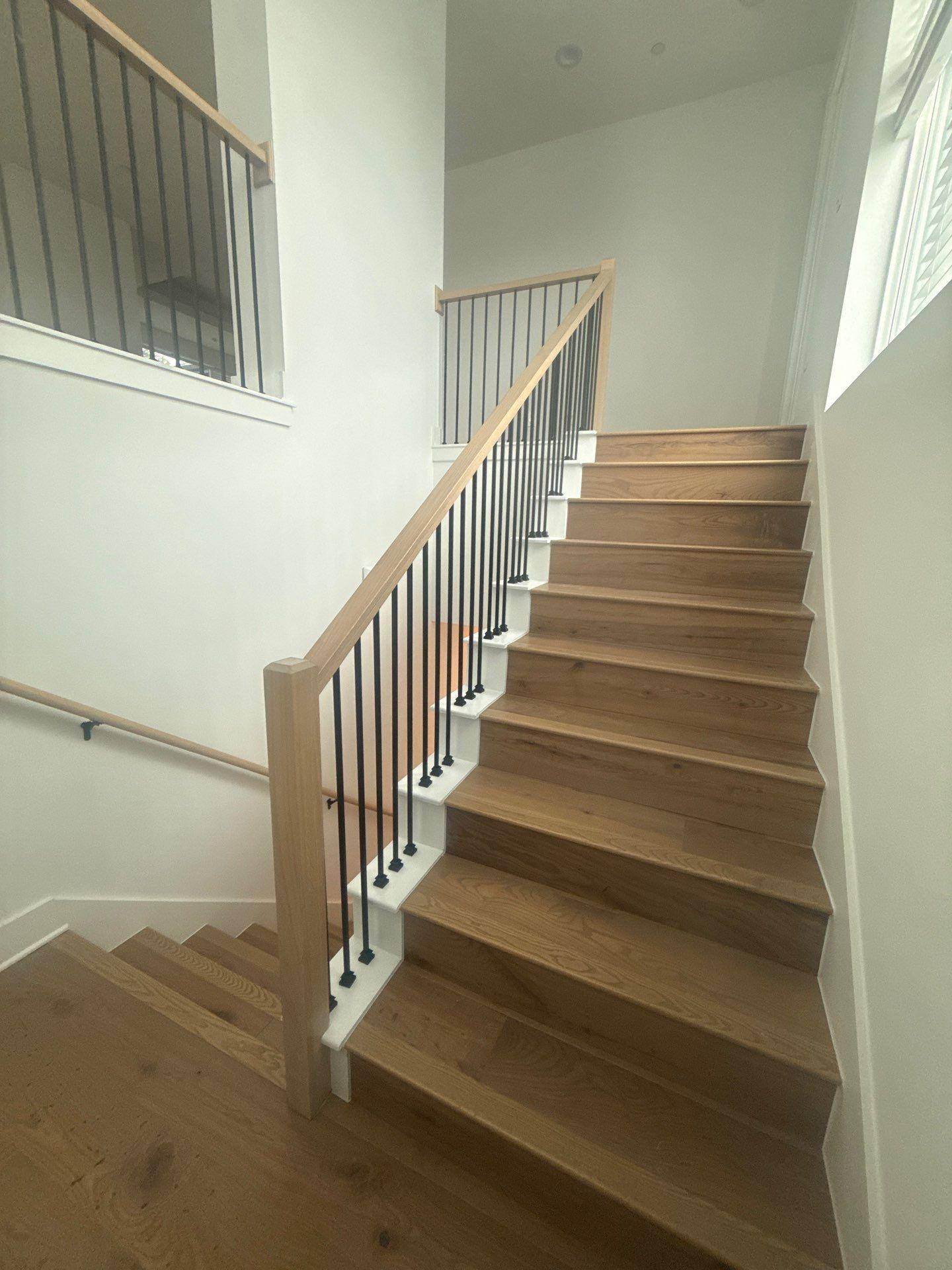 Staircase of a home in Austin, TX ahead of interior painting by Hill Country Painting