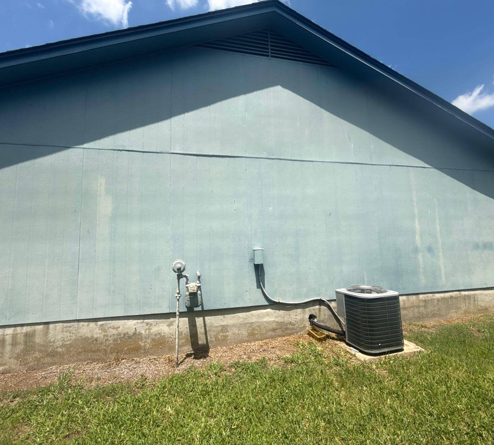 Side exterior siding of a home in Austin, TX showing surface condition ahead of exterior painting by Hill Country Painting
