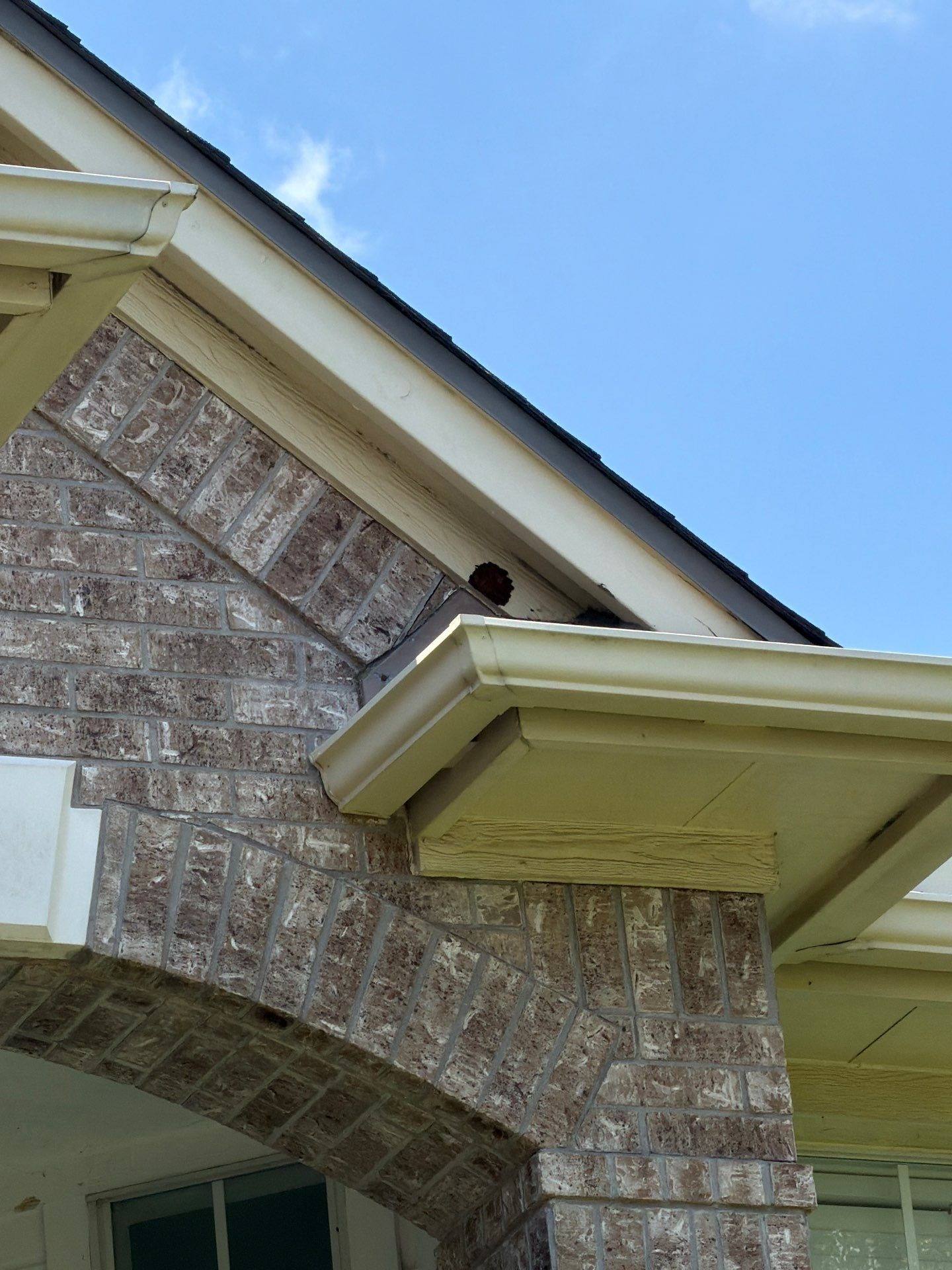 Front porch gable and brick column detail on a home in Austin, TX ahead of exterior painting by Hill Country Painting