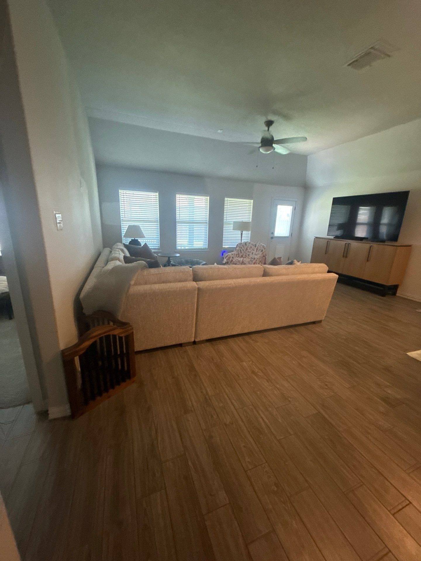 Living room and kitchen area of a home in Hutto, TX ahead of interior painting by Hill Country Painting