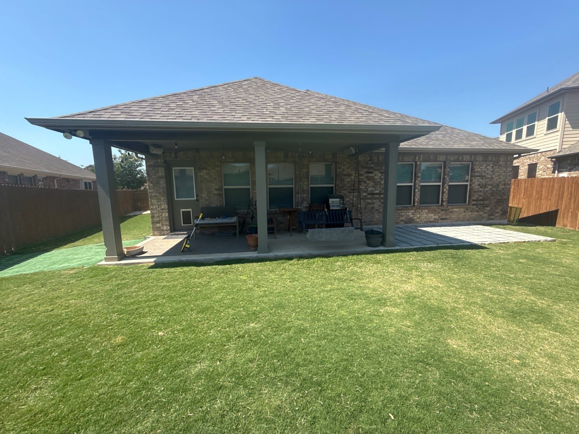 Covered back patio of a home in Hutto, TX ahead of exterior painting by Hill Country Painting