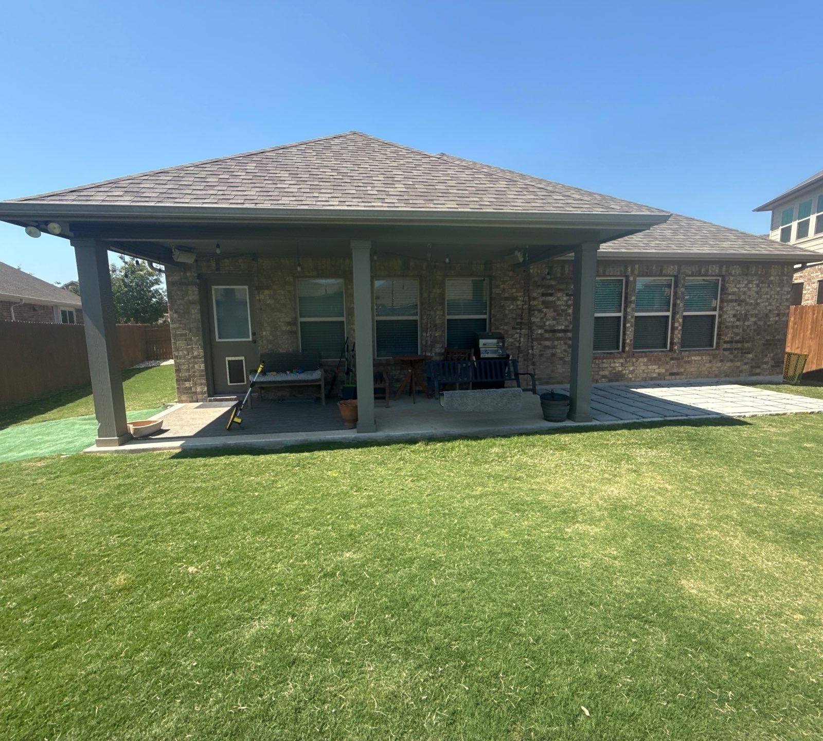Covered back patio of a home in Hutto, TX ahead of exterior painting by Hill Country Painting