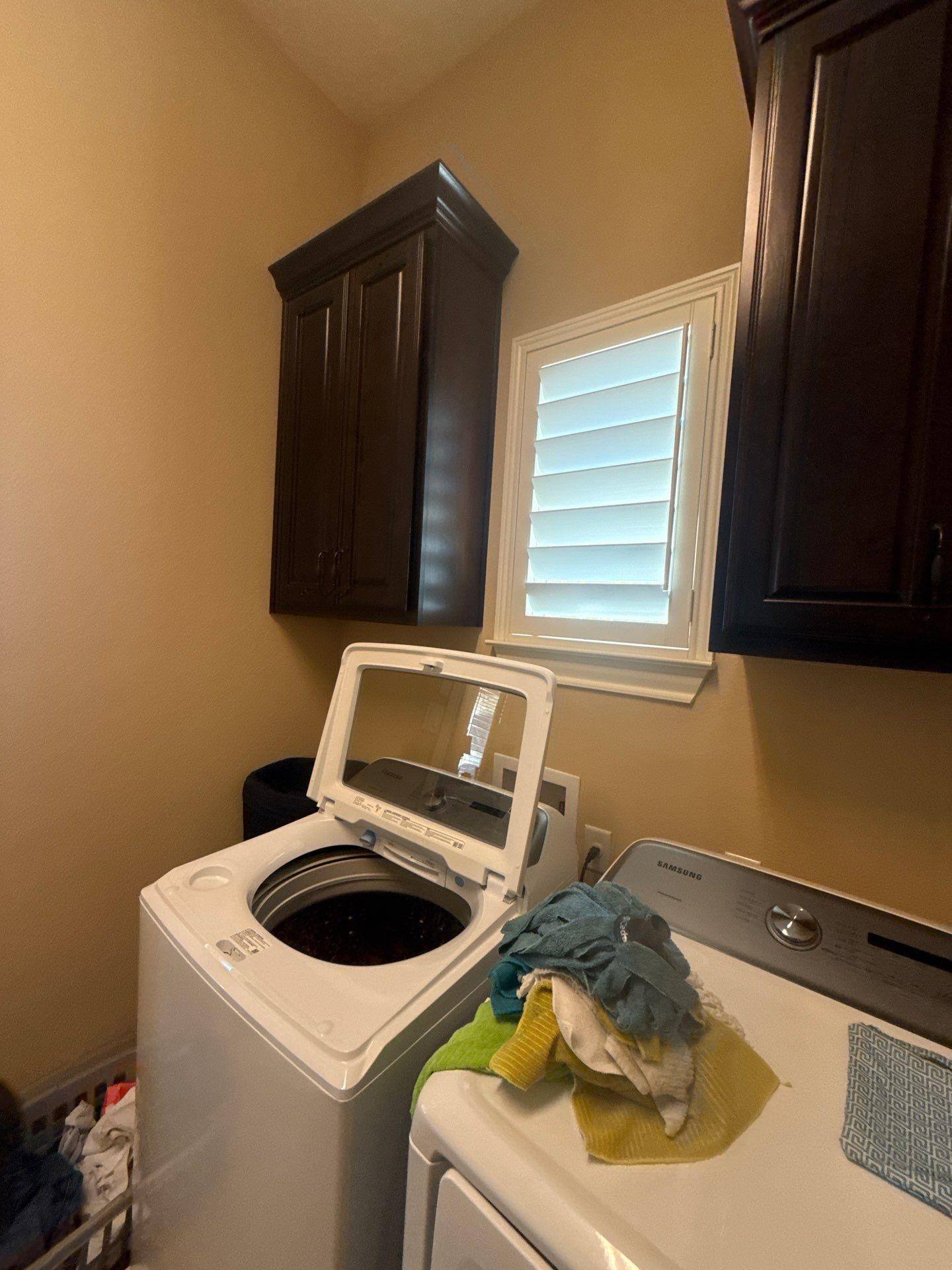 Laundry room in a home in Austin, TX ahead of interior painting by Hill Country Painting