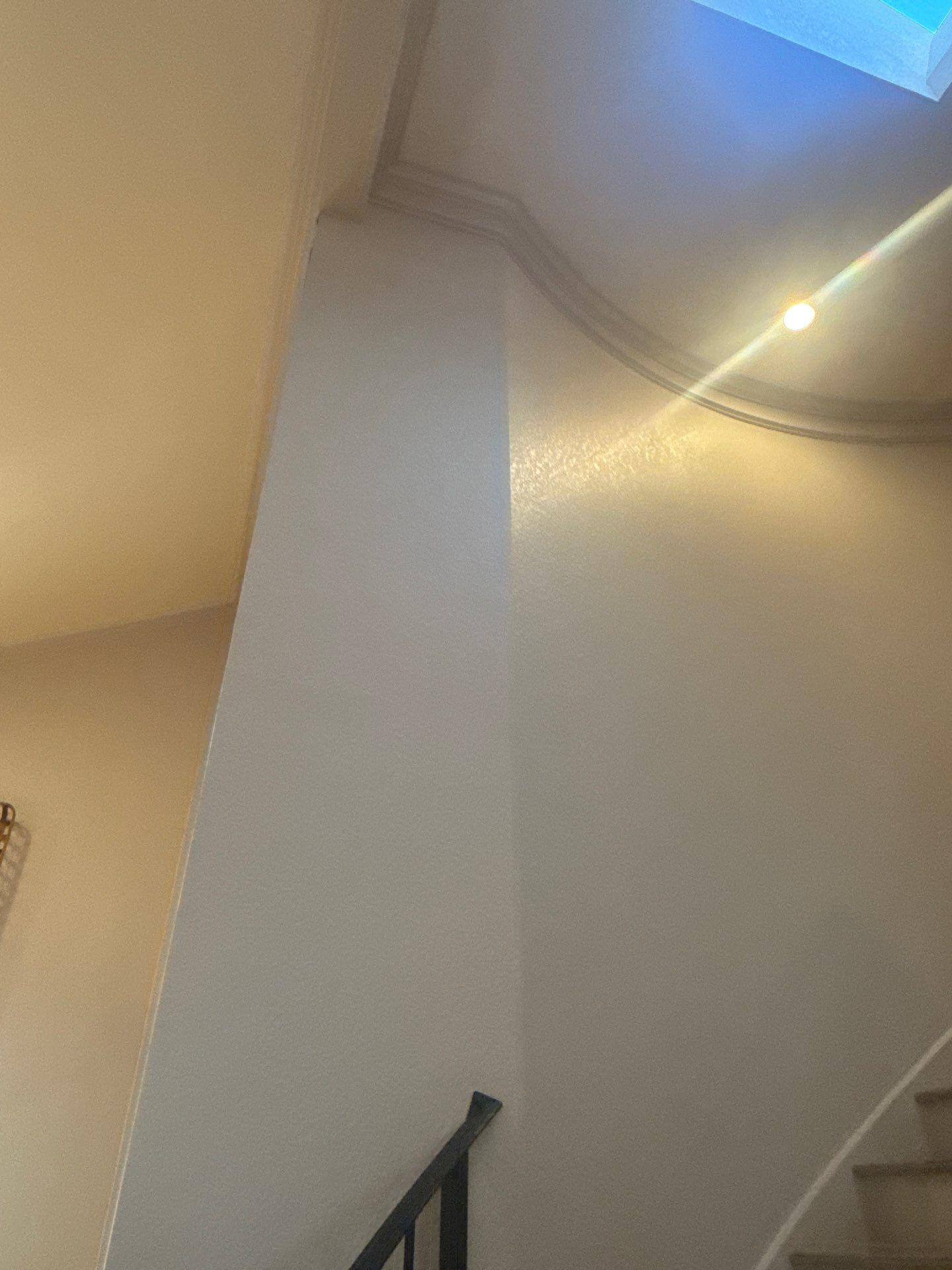 Stairwell ceiling and lighting detail in a home on Challenger in Lakeway, TX ahead of an interior painting estimate by Hill Country Painting