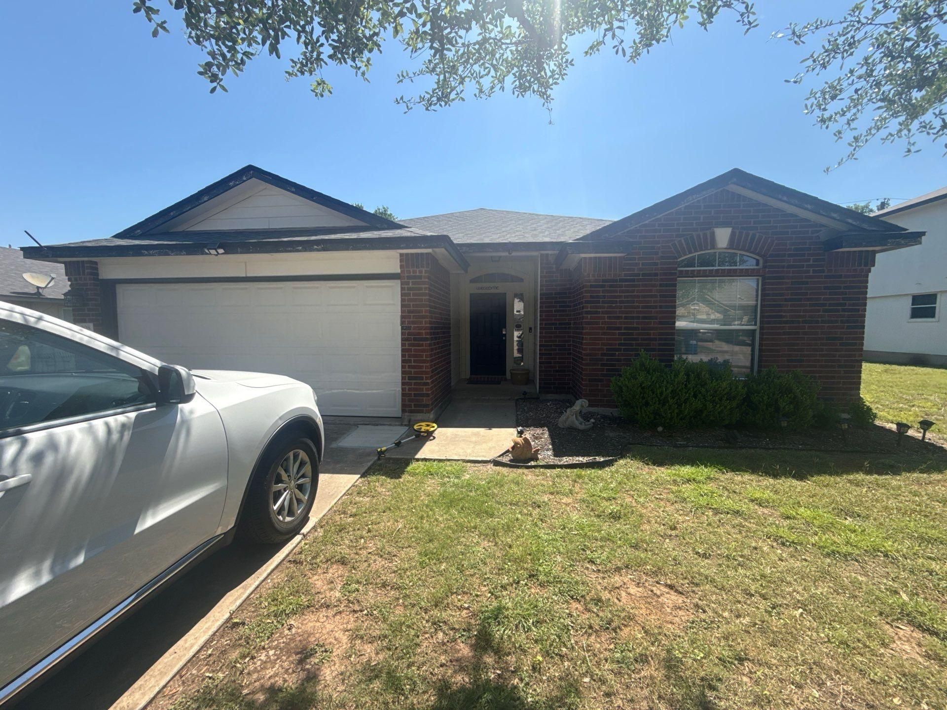 Front exterior of a home on Delby St in Hutto, TX ahead of interior and exterior painting by Hill Country Painting