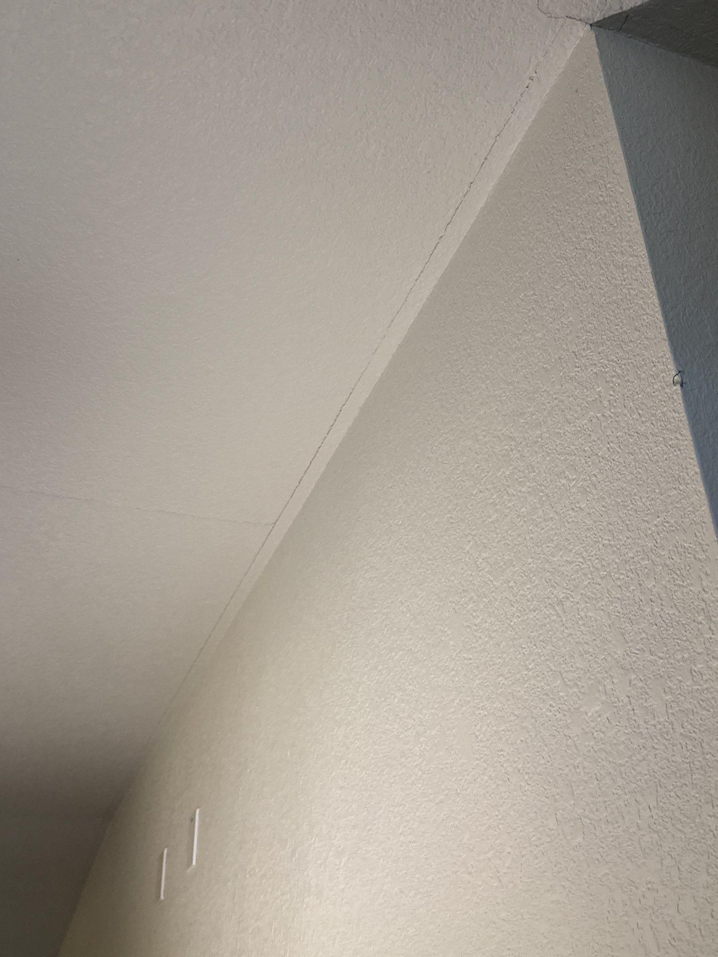 Ceiling crack detail ahead of drywall repair and interior painting by Hill Country Painting in Round Rock, TX
