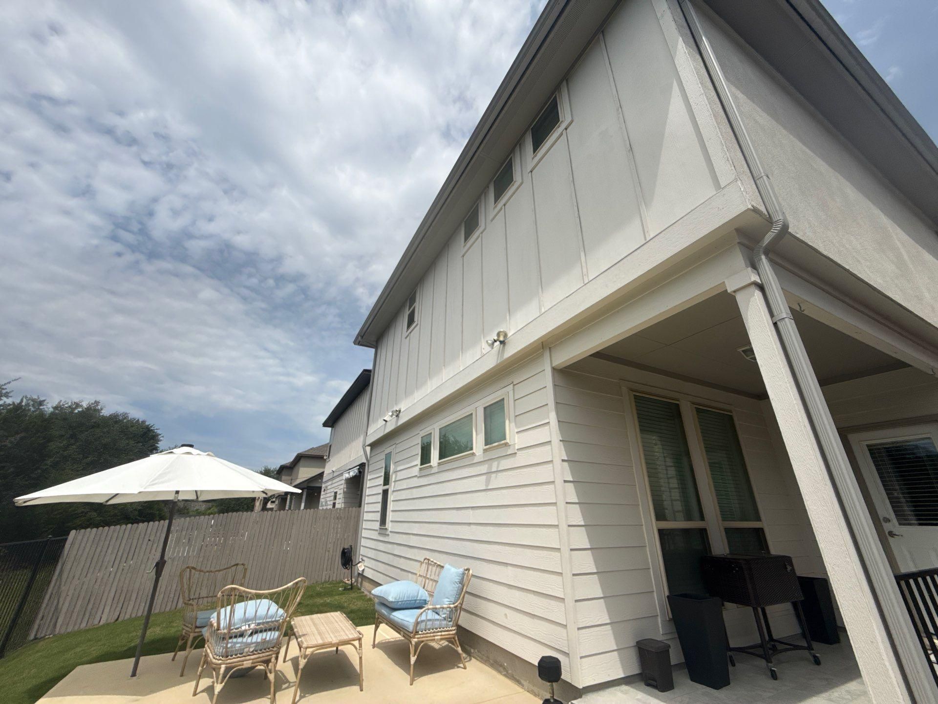 Back patio and exterior of a townhome on Westinghouse in Round Rock, TX ahead of exterior painting by Hill Country Painting