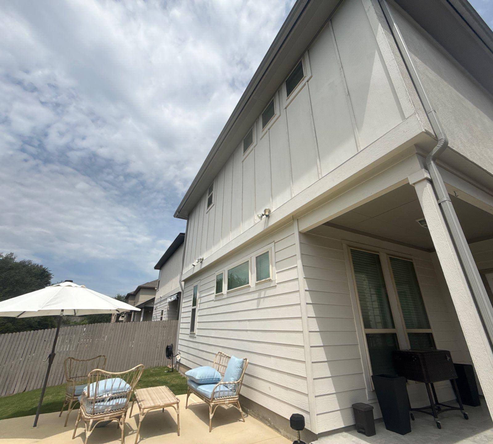 Back patio and exterior of a townhome on Westinghouse in Round Rock, TX ahead of exterior painting by Hill Country Painting