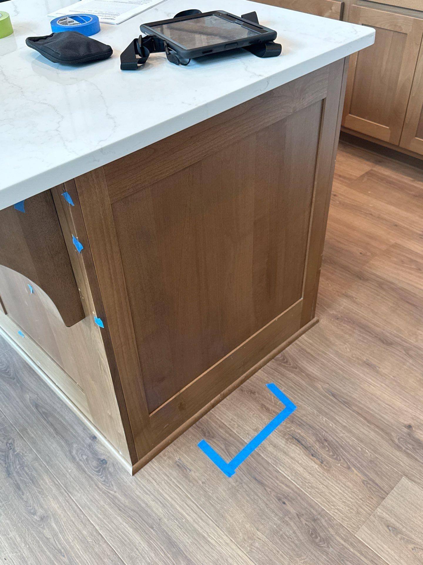 Refinished kitchen island cabinet in a home on Covered Bridge Trl in Georgetown, TX by Hill Country Painting