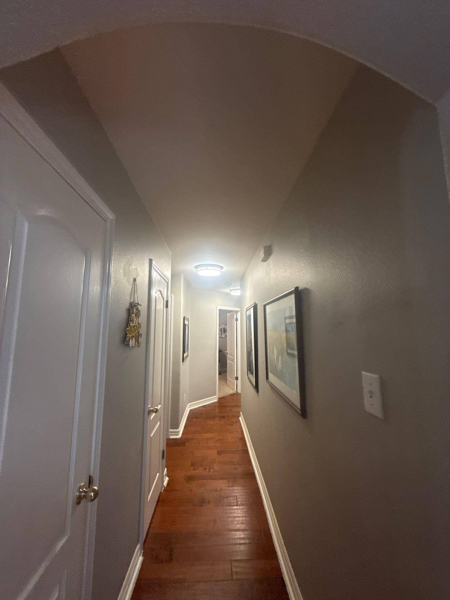 Hallway with arched ceiling in a home on Laurel Bay Loop in Round Rock, TX by Hill Country Painting