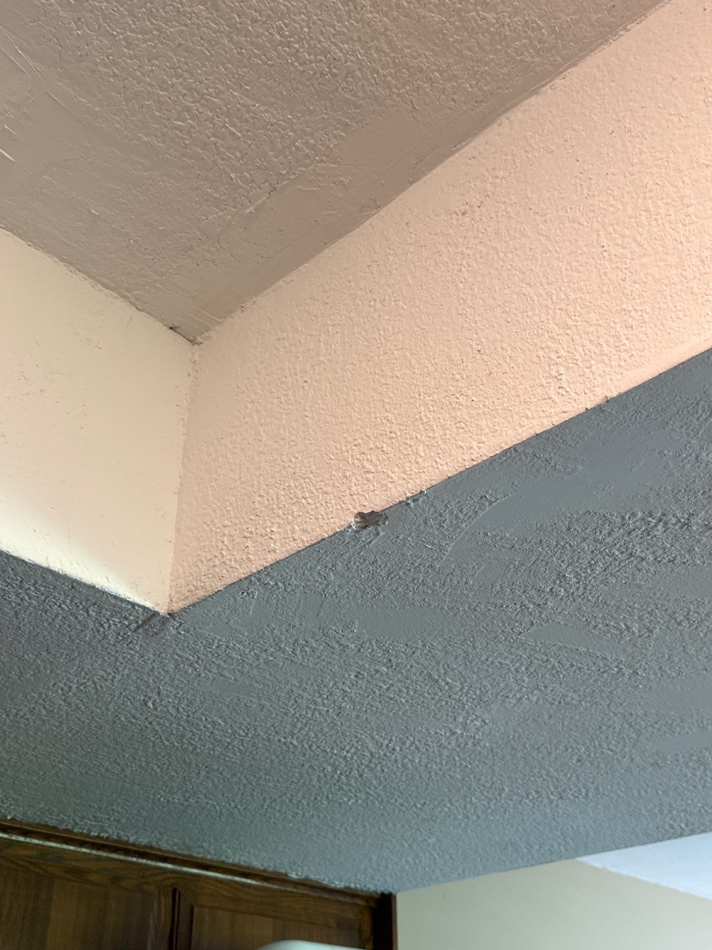 Wall corner showing texture damage in a home on Granada Hills Dr in Austin, TX before re-texture and painting by Hill Country Painting