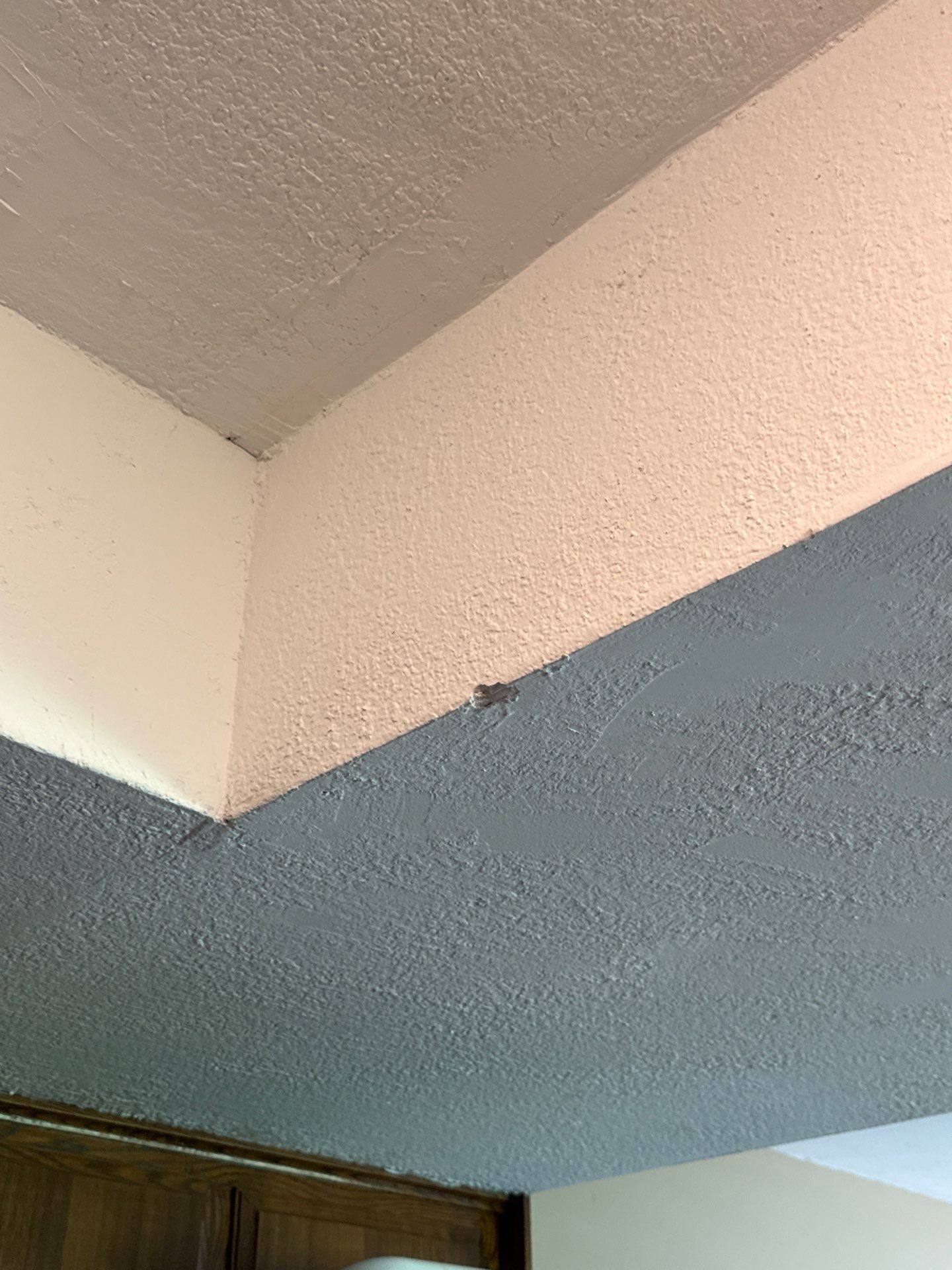 Wall corner showing texture damage in a home on Granada Hills Dr in Austin, TX before re-texture and painting by Hill Country Painting