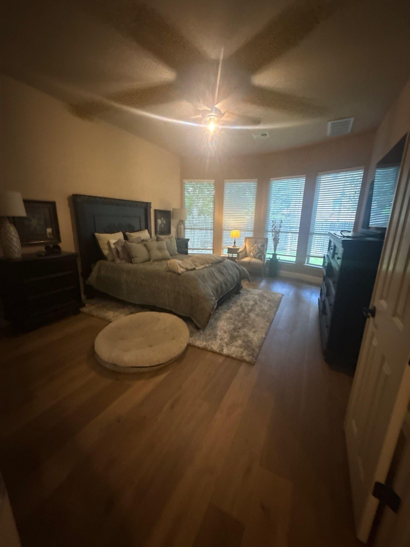 Master bedroom in a home on Rhondstat Run in Cedar Park, TX prepared for painting by Hill Country Painting