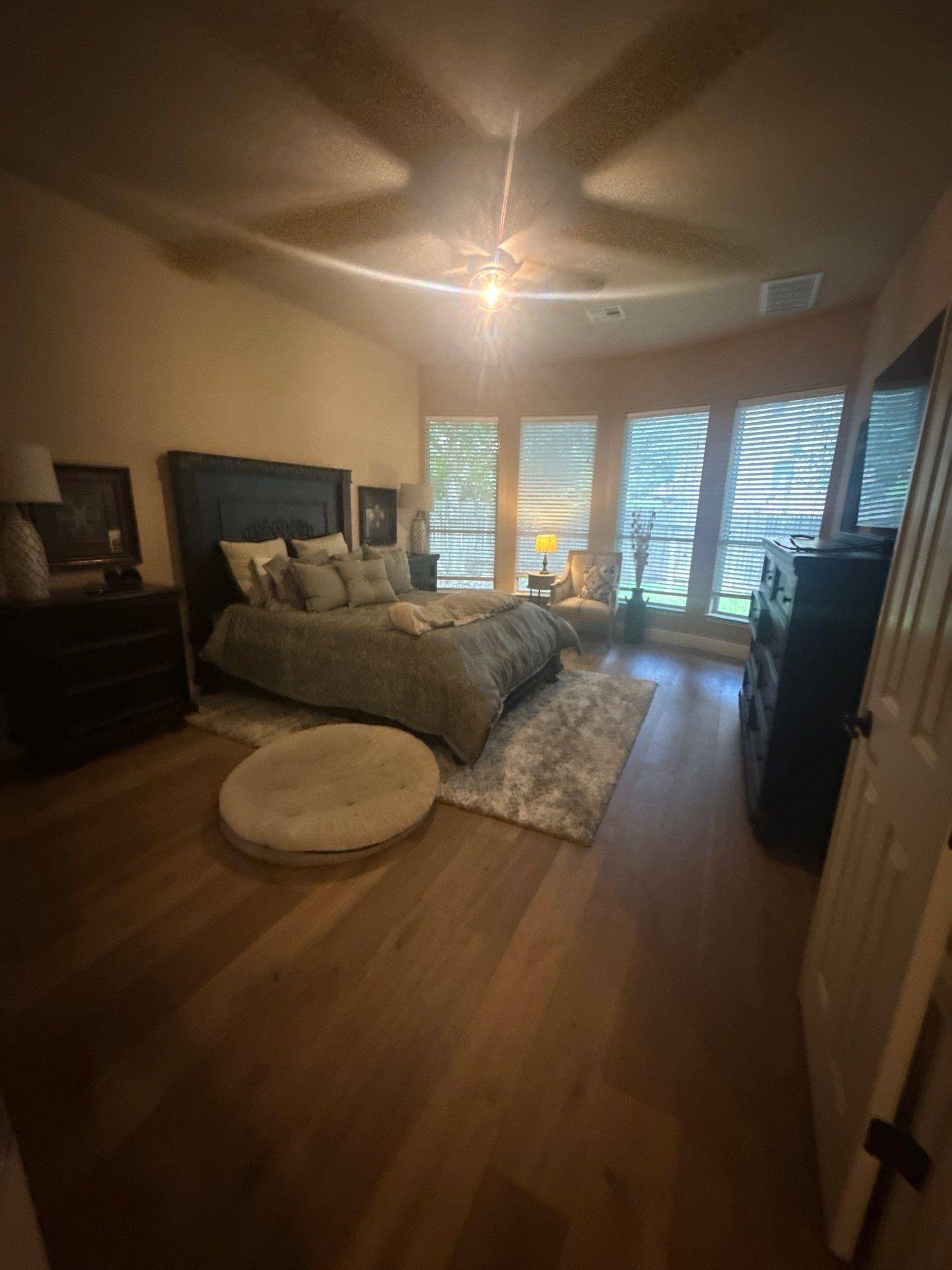 Master bedroom in a home on Rhondstat Run in Cedar Park, TX prepared for painting by Hill Country Painting