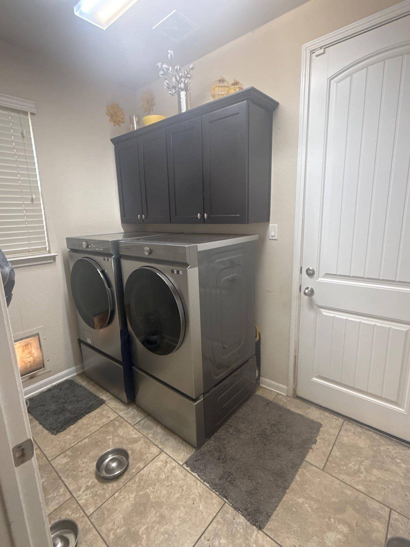Laundry room in a home on Mossy Grove Ct in Cedar Park, TX prepared for painting by Hill Country Painting