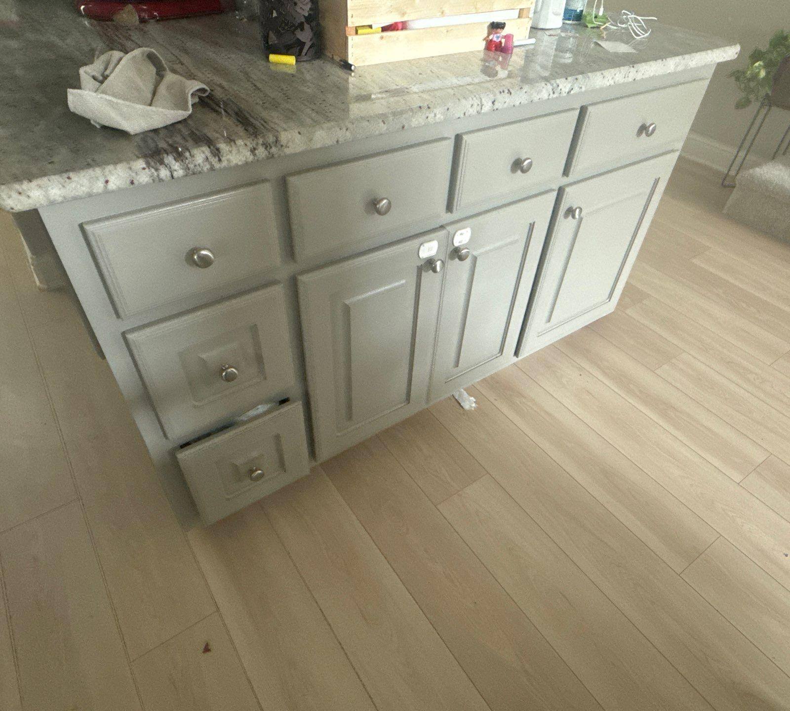 Kitchen island cabinet doors and drawers in a home on Tuberose Terrace in Austin, TX refinished by Hill Country Painting