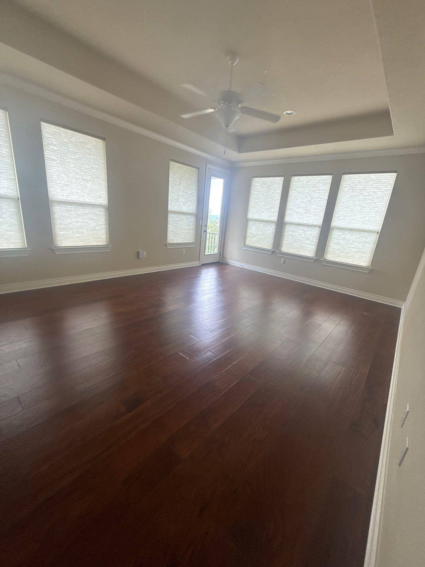 Master bedroom in a home on Palazza Alto Dr in Austin, TX prepared for painting by Hill Country Painting
