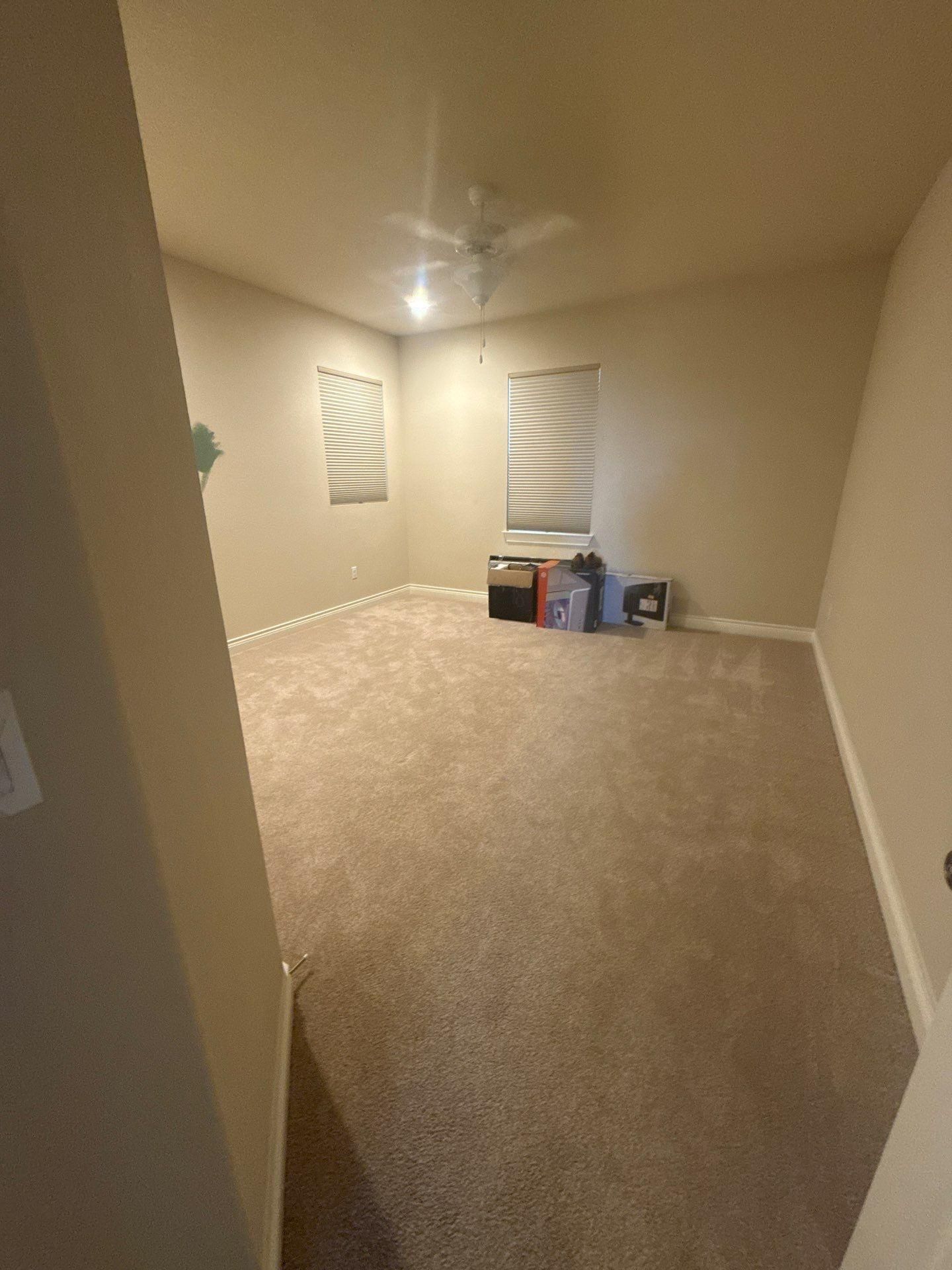 Bedroom in a home on Palazza Alto Dr in Austin, TX prepared for painting by Hill Country Painting