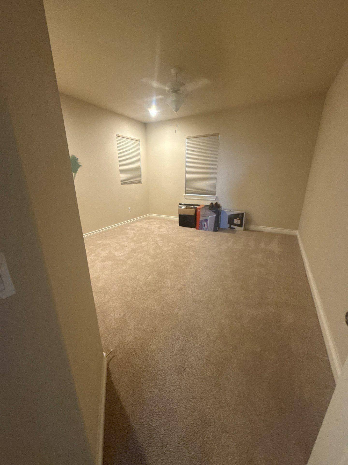 Bedroom in a home on Palazza Alto Dr in Austin, TX prepared for painting by Hill Country Painting