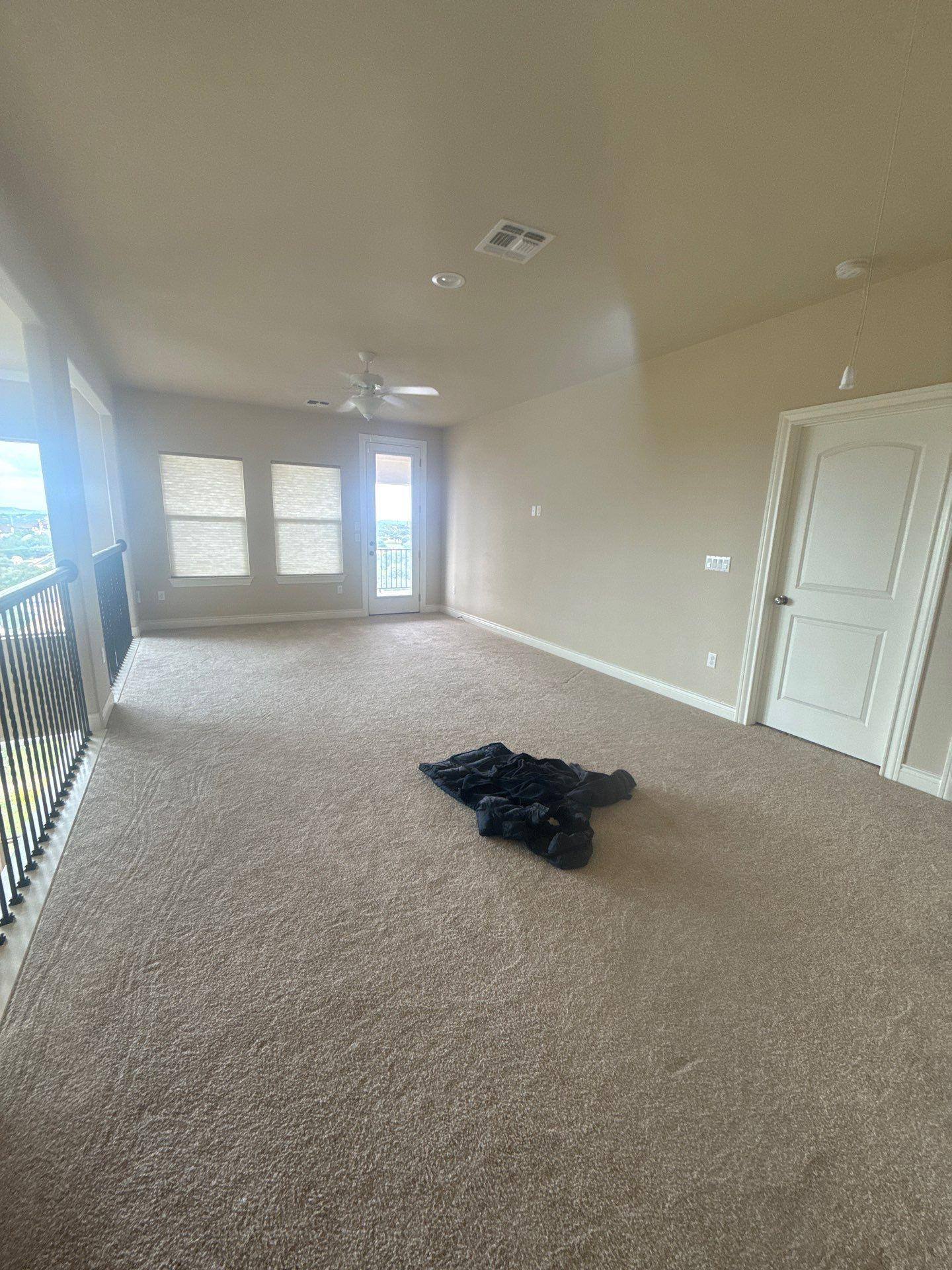Upstairs loft area in a home on Palazza Alto Dr in Austin, TX prepared for painting by Hill Country Painting