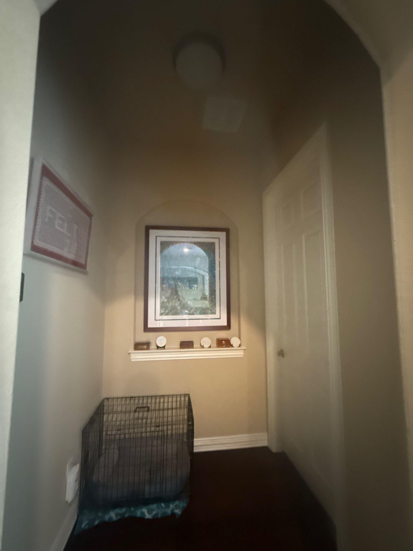 Hallway of a home on Straw Flower Dr in Austin, TX prepared for painting by Hill Country Painting