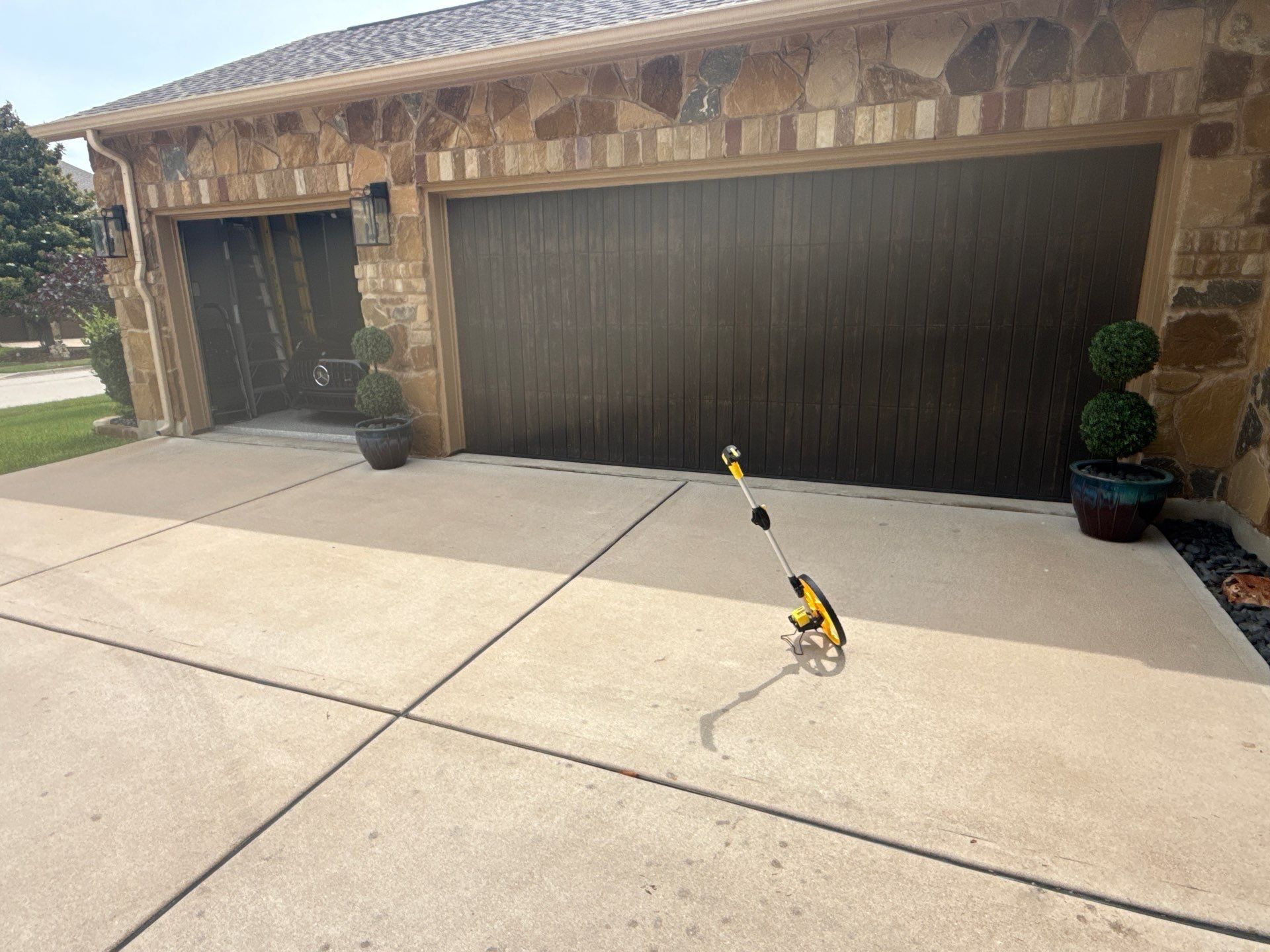 Garage door on a home on Avery Woods Ln in Cedar Park, TX prepared for a painting estimate by Hill Country Painting
