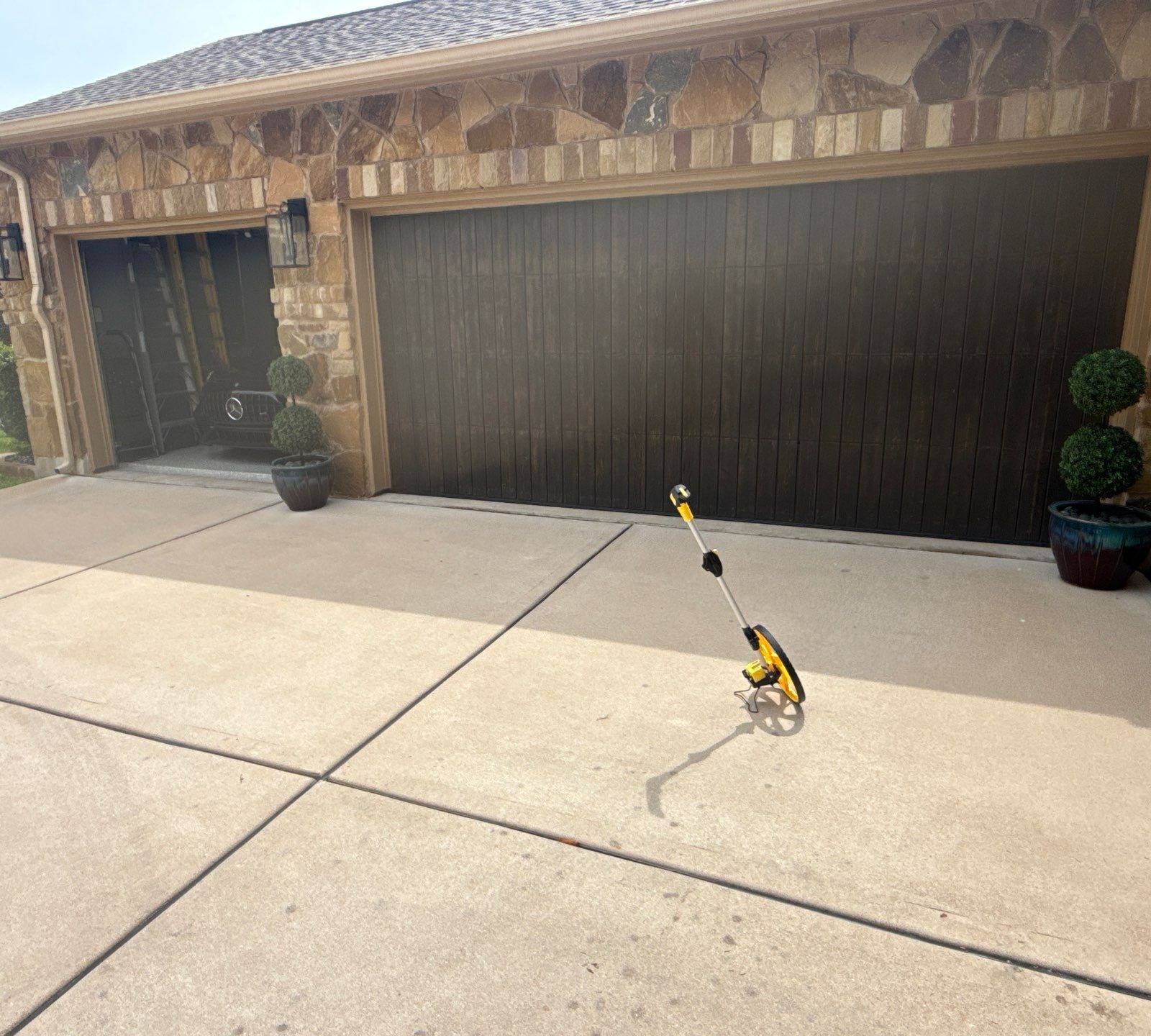 Garage door on a home on Avery Woods Ln in Cedar Park, TX prepared for a painting estimate by Hill Country Painting