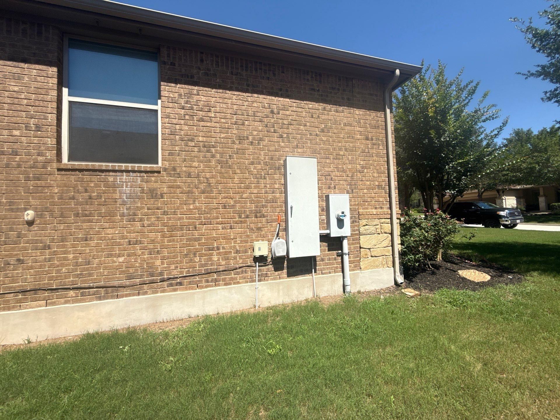 Side elevation of a home on Flycatcher Ct in Austin, TX prepared for an exterior painting estimate by Hill Country Painting