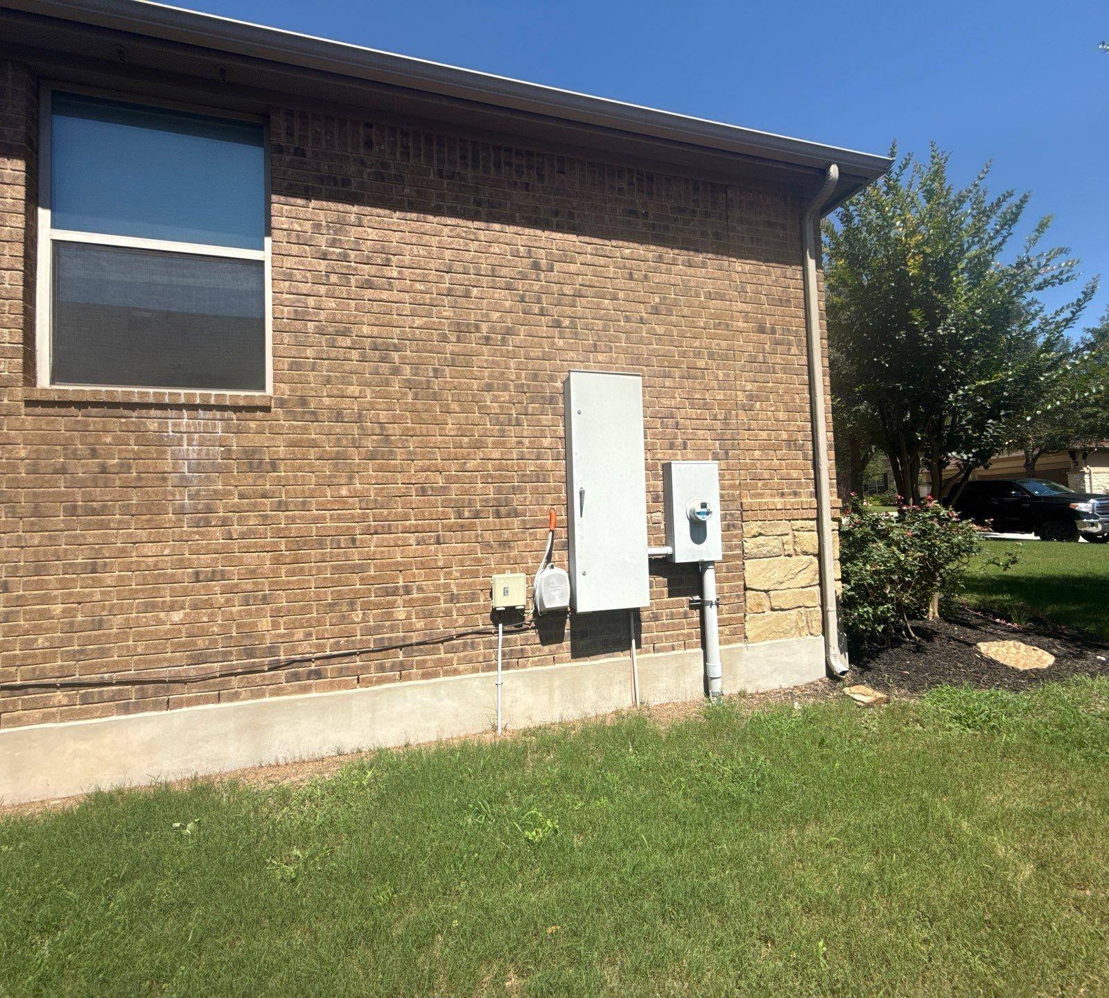 Side elevation of a home on Flycatcher Ct in Austin, TX prepared for an exterior painting estimate by Hill Country Painting