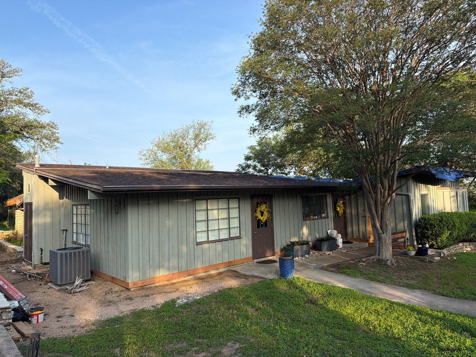 Front entry area of a home on St Stephens Dr in Austin, TX during an exterior painting project by Hill Country Painting