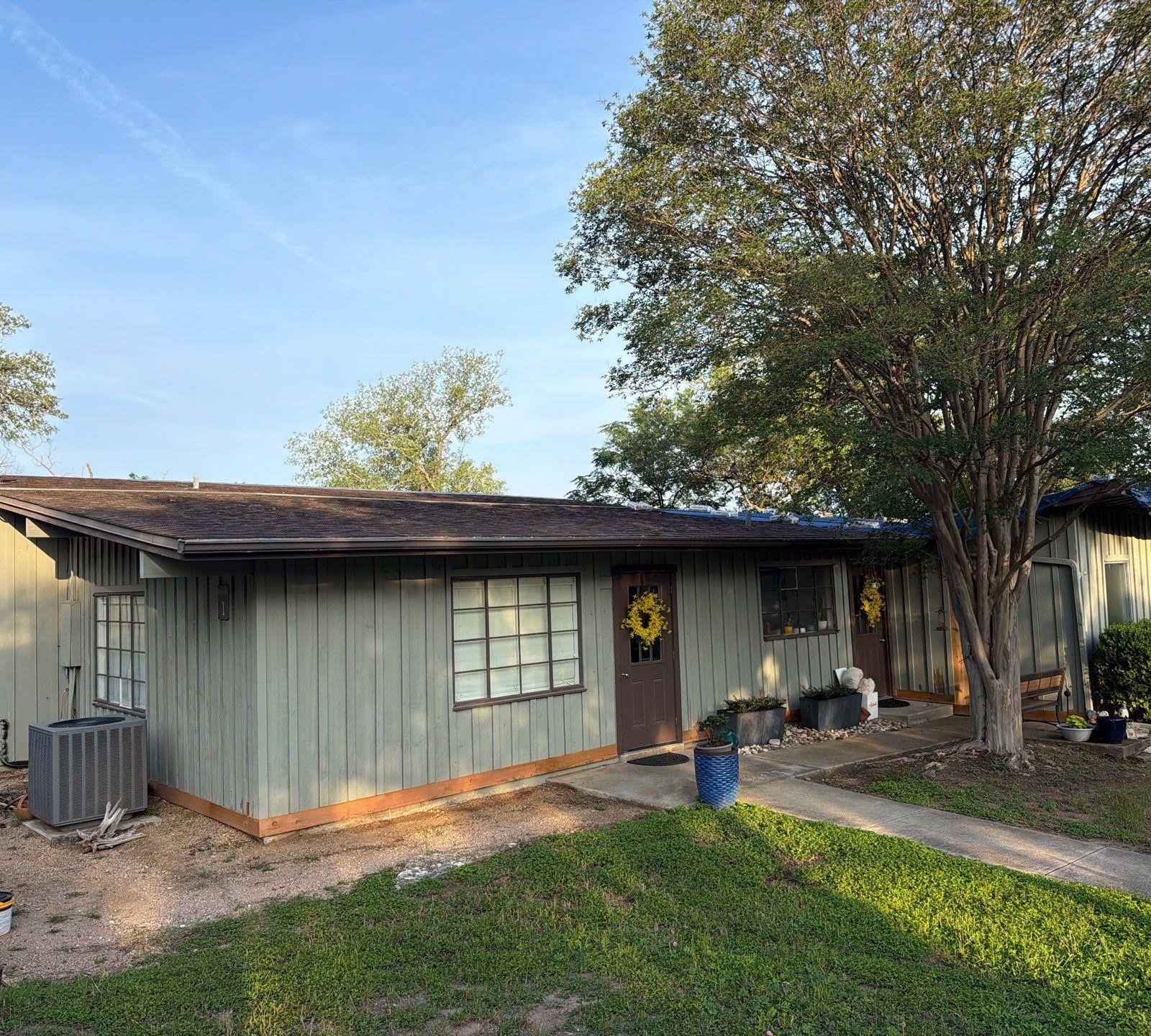 Front entry area of a home on St Stephens Dr in Austin, TX during an exterior painting project by Hill Country Painting