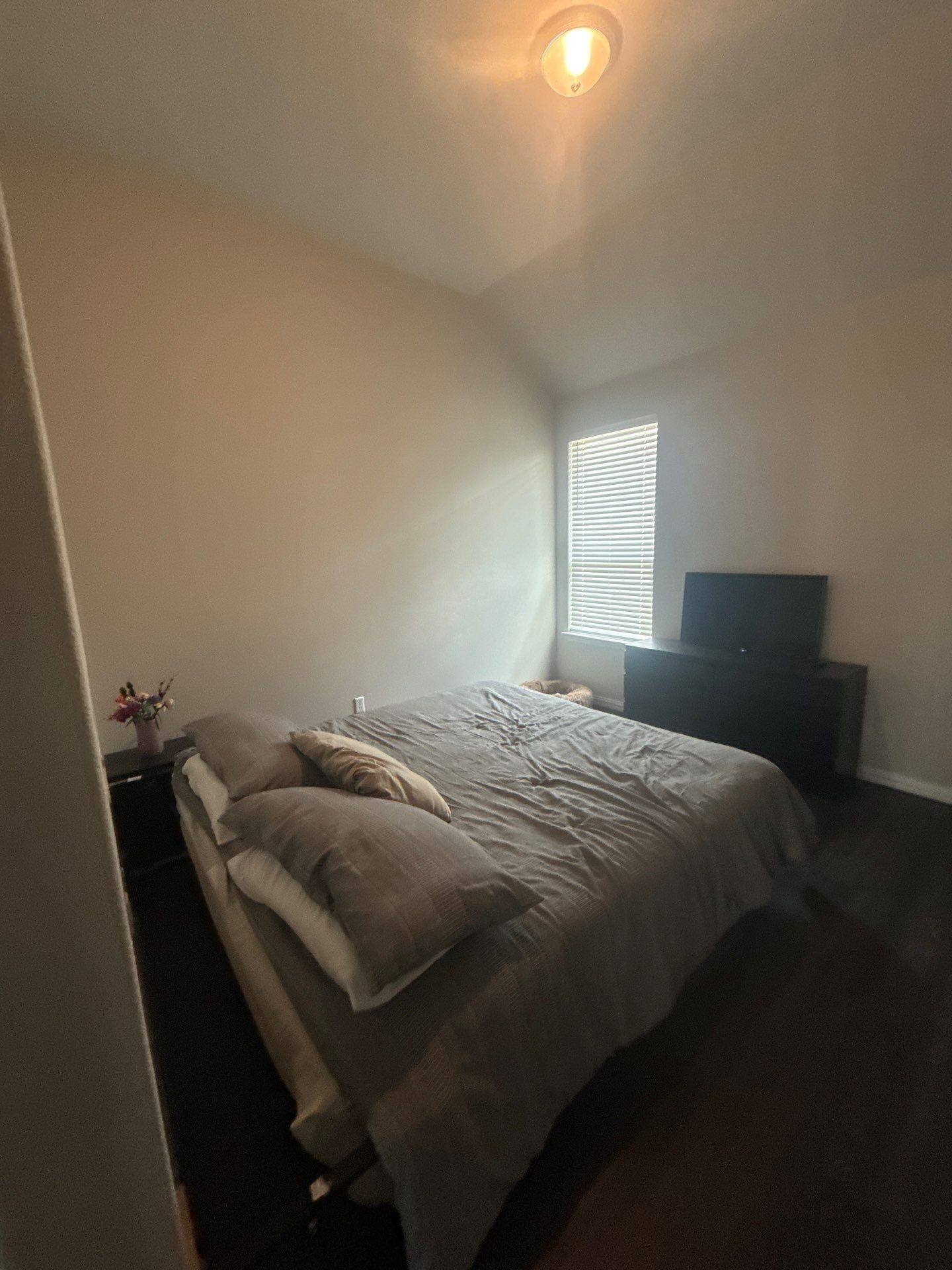 Bedroom of a home on Twisted Root Dr in Manchaca, TX prepared for an interior painting estimate by Hill Country Painting