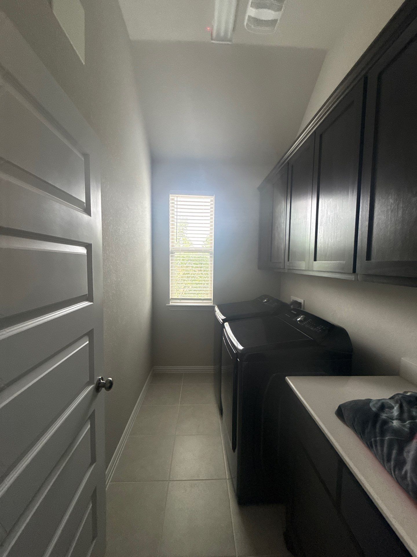 Laundry room of a home on Twisted Root Dr in Manchaca, TX prepared for an interior painting estimate by Hill Country Painting