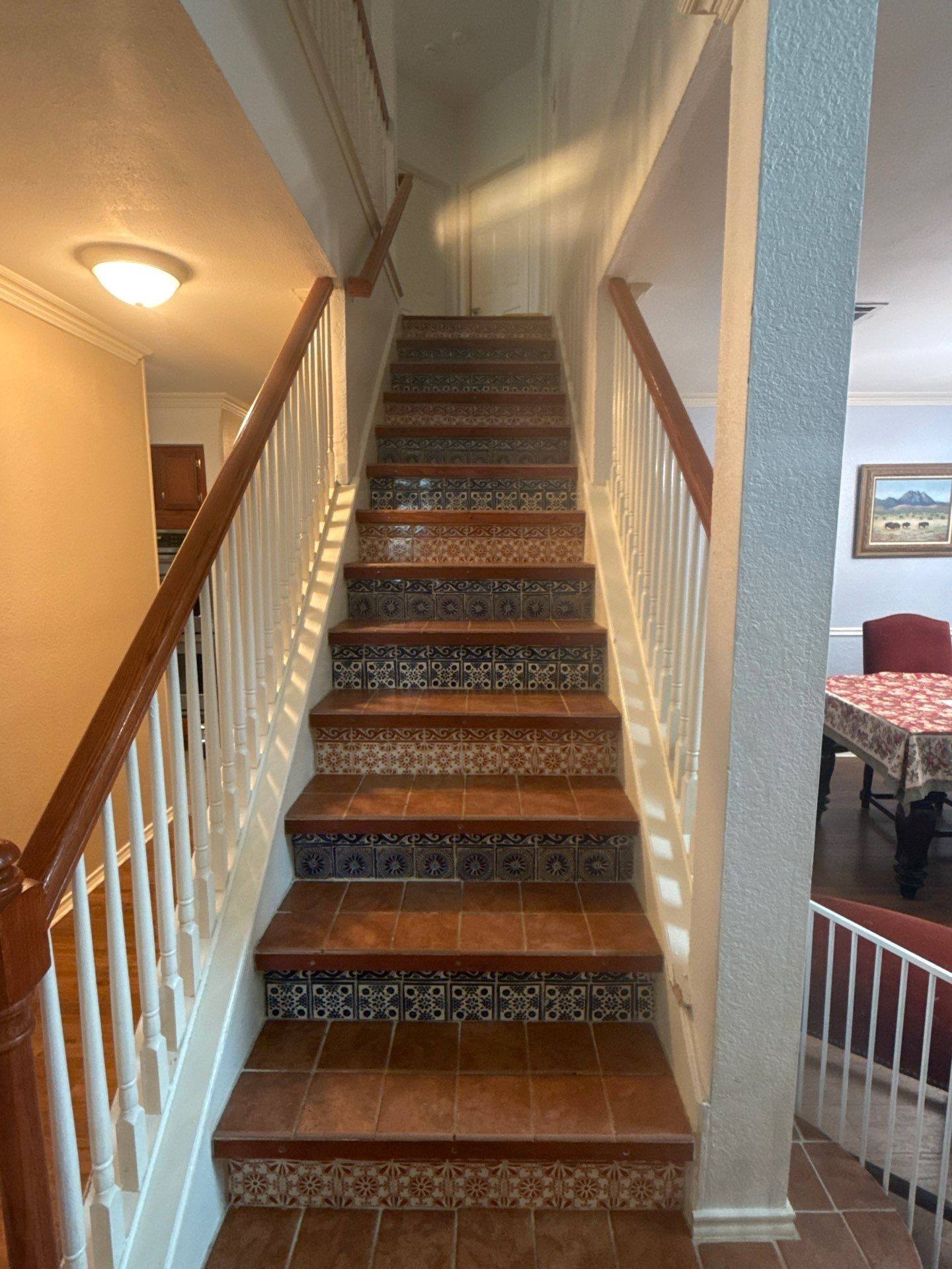 Staircase of a home on Napier Trail in Austin, TX prepared for an interior painting estimate by Hill Country Painting