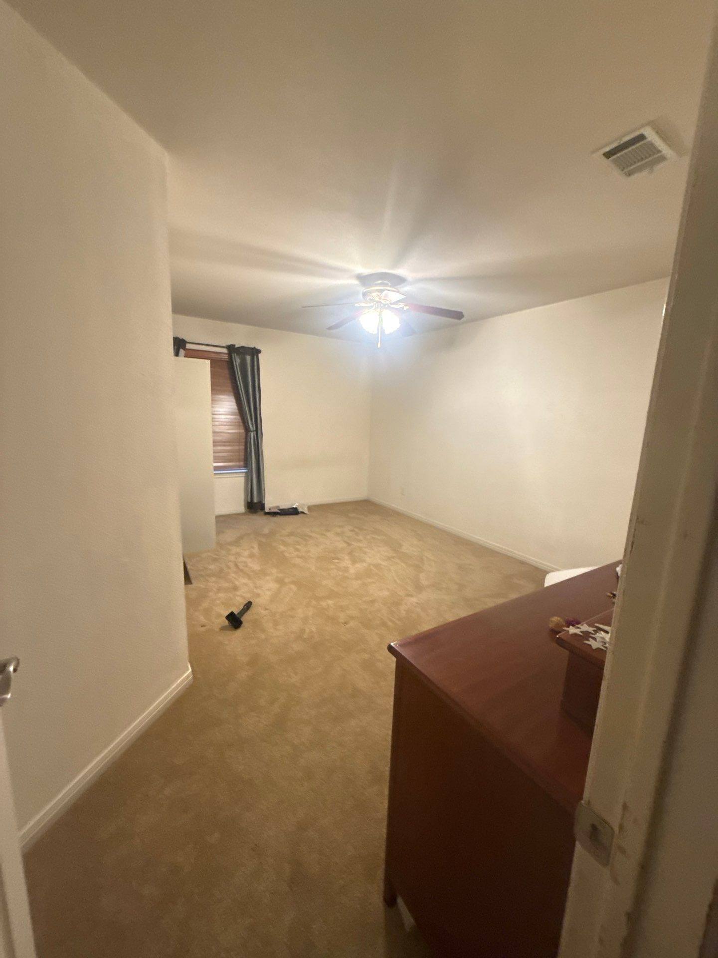 Bedroom of a home on Blue Lilly Dr in Austin, TX ahead of interior painting by Hill Country Painting