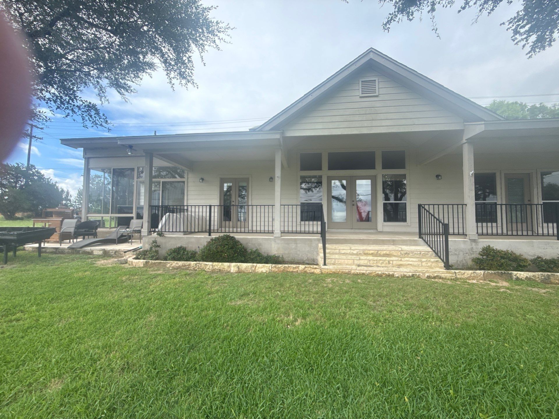 Back porch of a home on Boggy Ford Rd in Lago Vista, TX ahead of exterior painting by Hill Country Painting