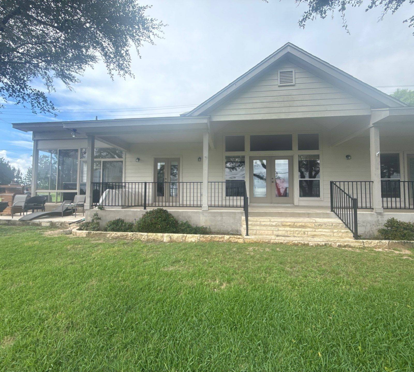 Back porch of a home on Boggy Ford Rd in Lago Vista, TX ahead of exterior painting by Hill Country Painting
