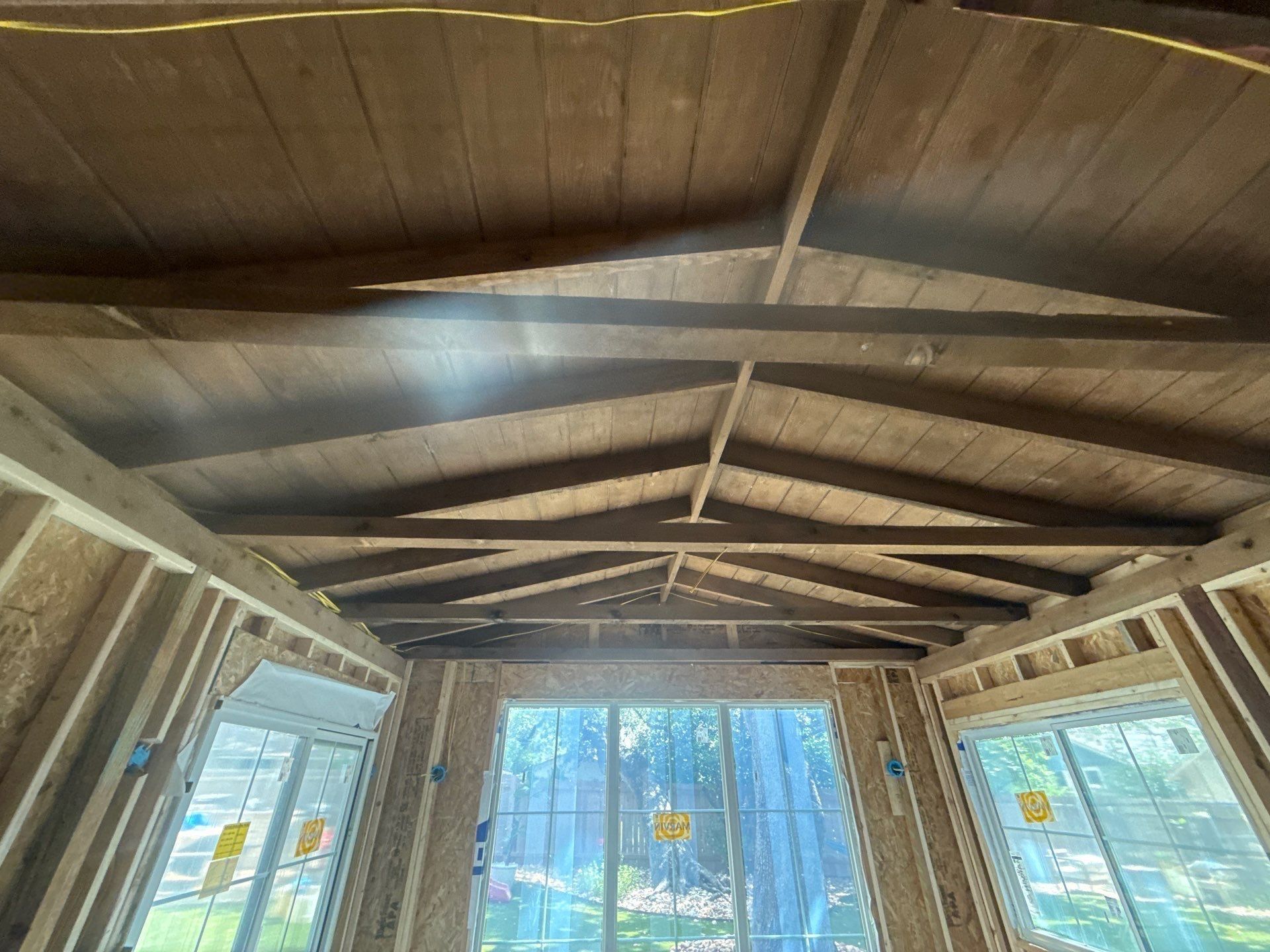 Vaulted ceiling framing of a home addition on Alhambra Dr in Austin, TX ahead of interior painting by Hill Country Painting