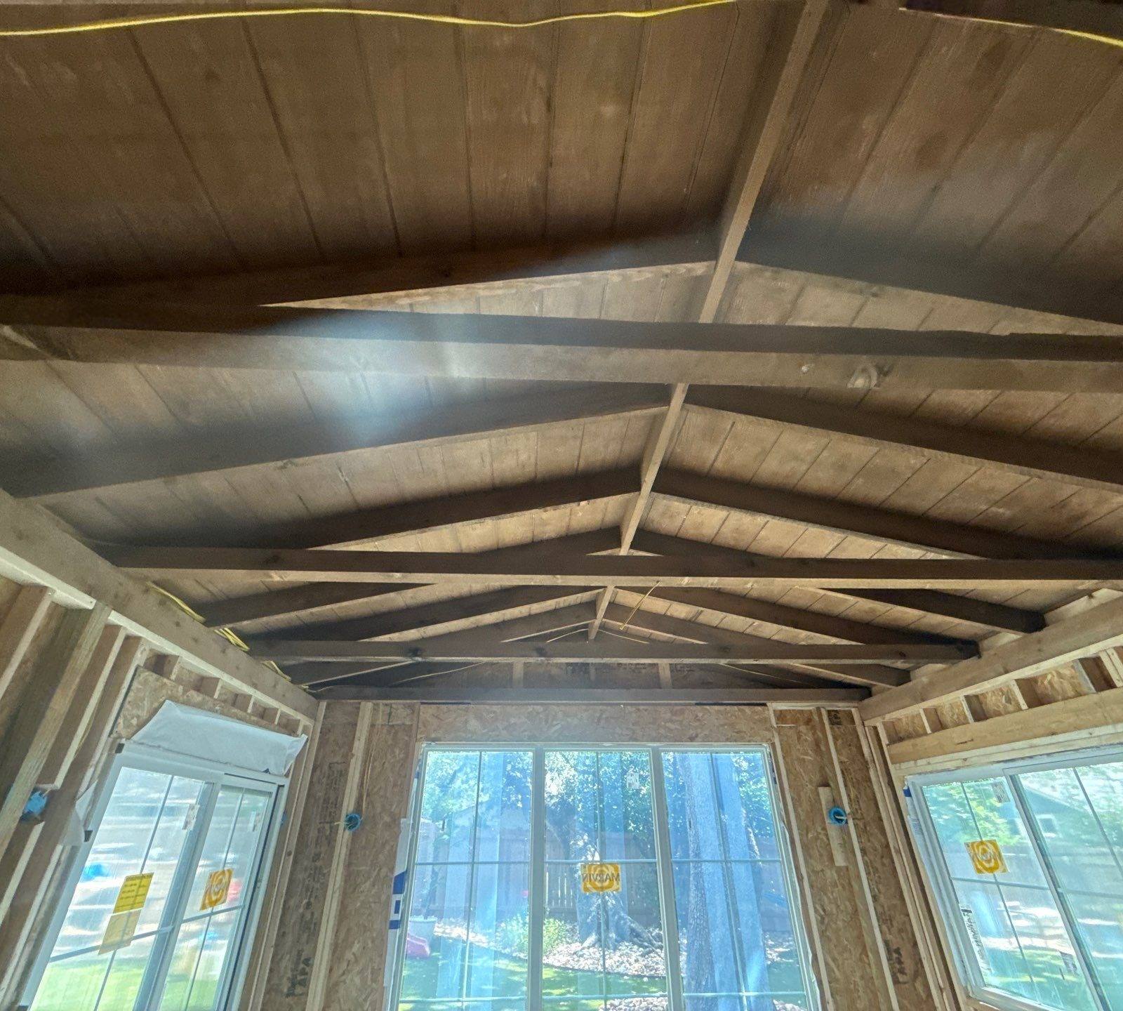 Vaulted ceiling framing of a home addition on Alhambra Dr in Austin, TX ahead of interior painting by Hill Country Painting