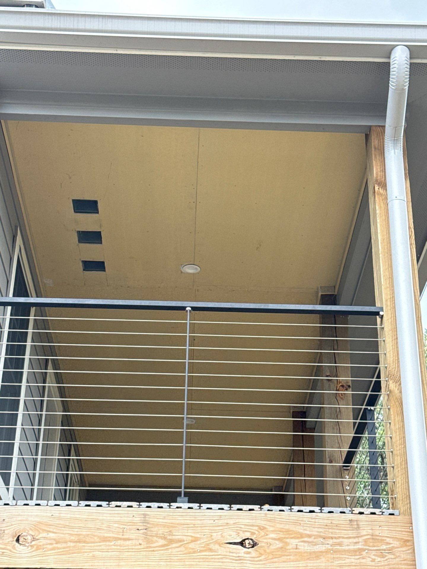 Upper balcony ceiling of a home on W Beach Rd in Austin, TX ahead of exterior painting by Hill Country Painting