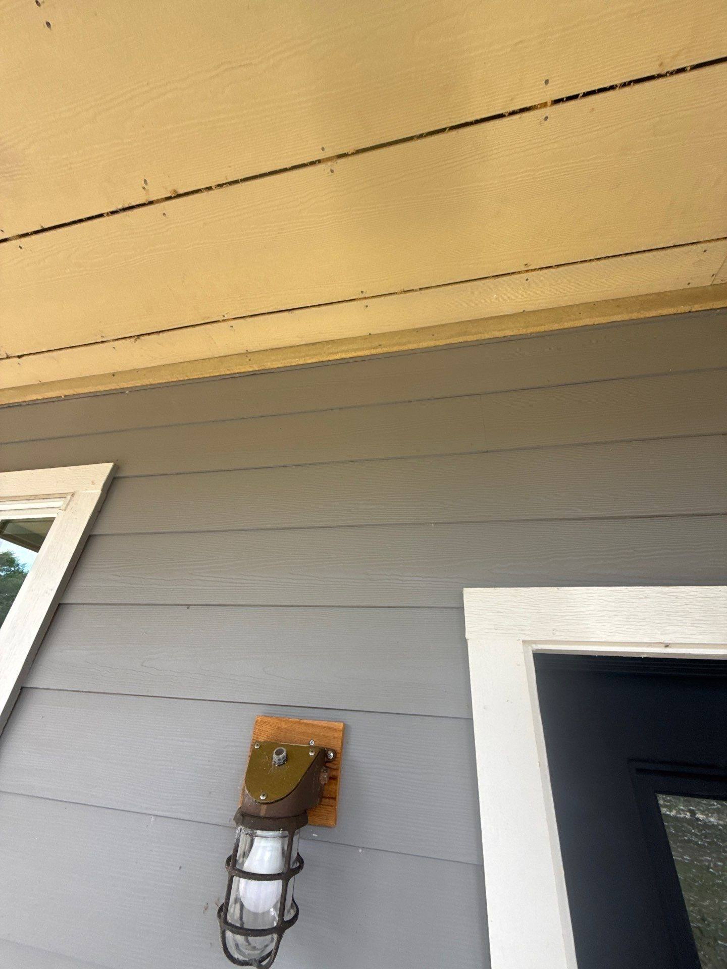 Porch ceiling and siding detail of a home on W Beach Rd in Austin, TX ahead of exterior painting by Hill Country Painting