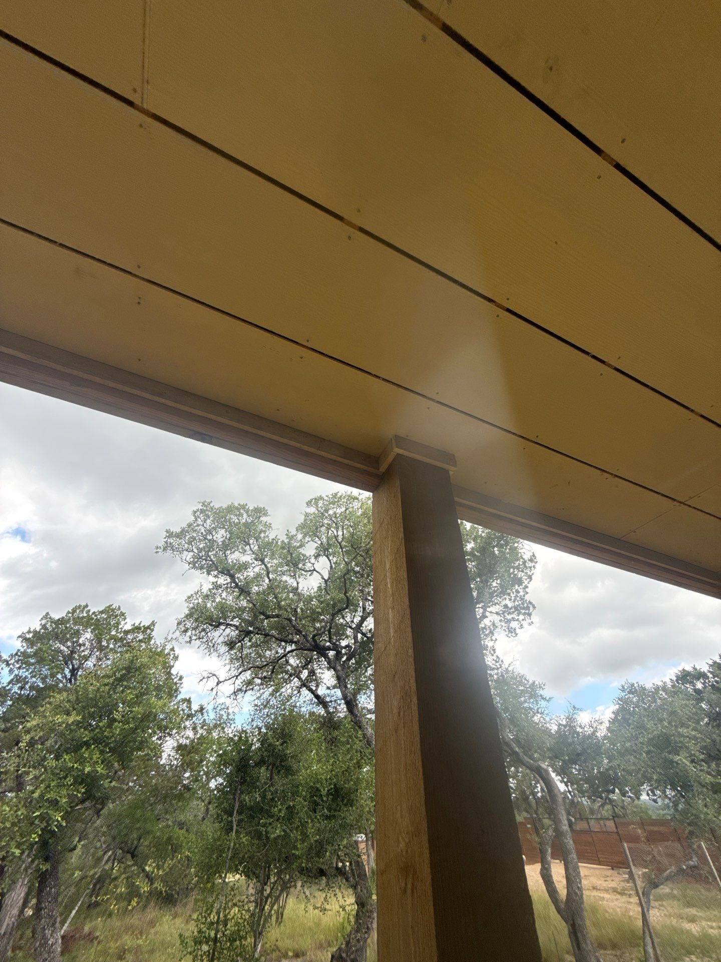 Porch ceiling and column of a home on W Beach Rd in Austin, TX ahead of exterior painting by Hill Country Painting