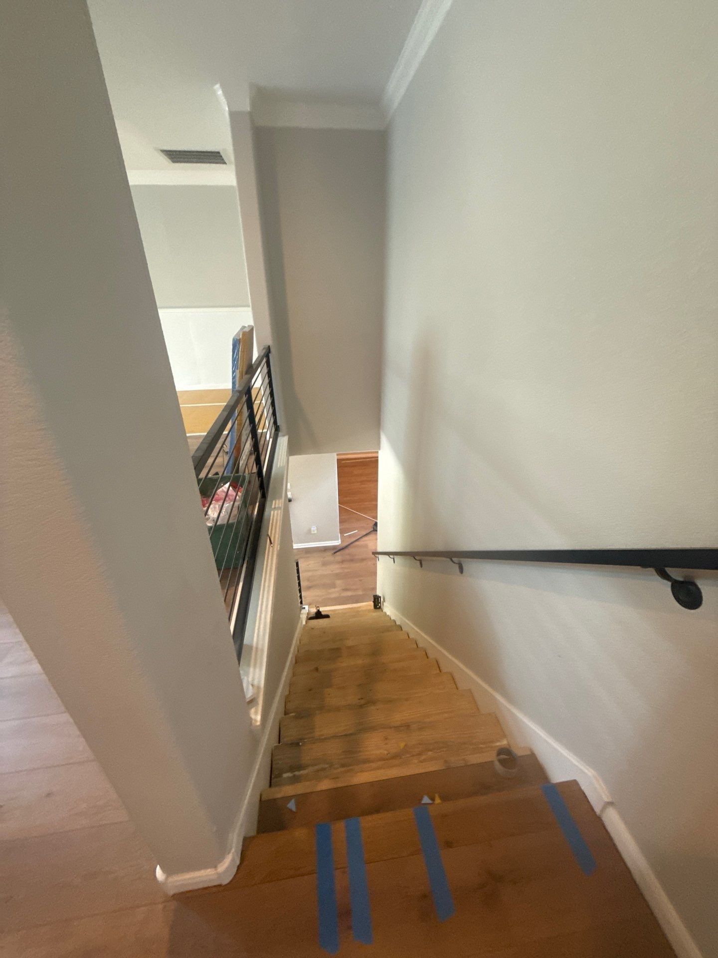 Stairwell of a home on Coalwood Cove in Austin, TX ahead of interior painting by Hill Country Painting
