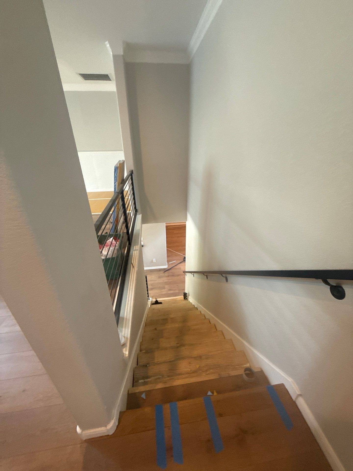 Stairwell of a home on Coalwood Cove in Austin, TX ahead of interior painting by Hill Country Painting