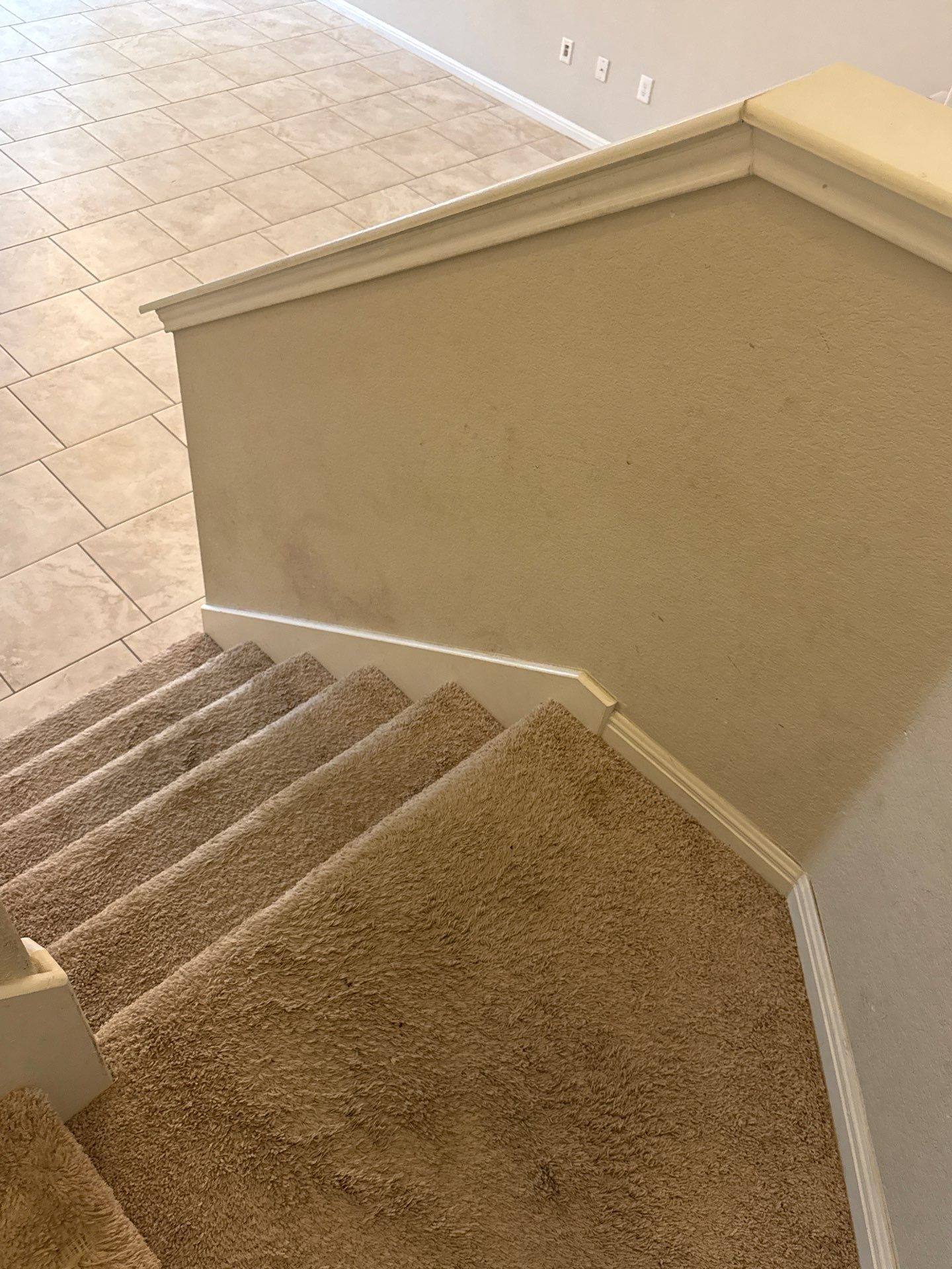 Stairwell of a home on Adage Dr in Pflugerville, TX ahead of interior painting by Hill Country Painting