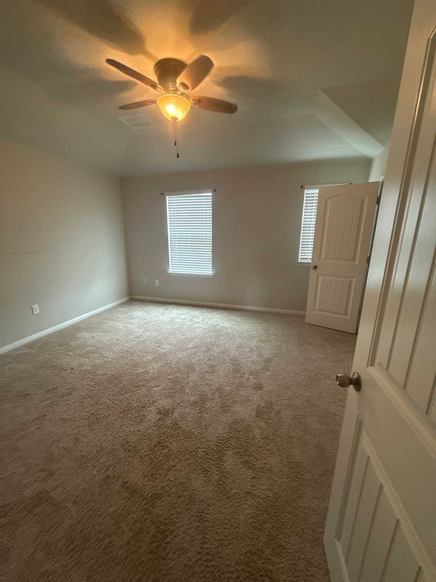 Bedroom of a home on Adage Dr in Pflugerville, TX ahead of interior painting by Hill Country Painting
