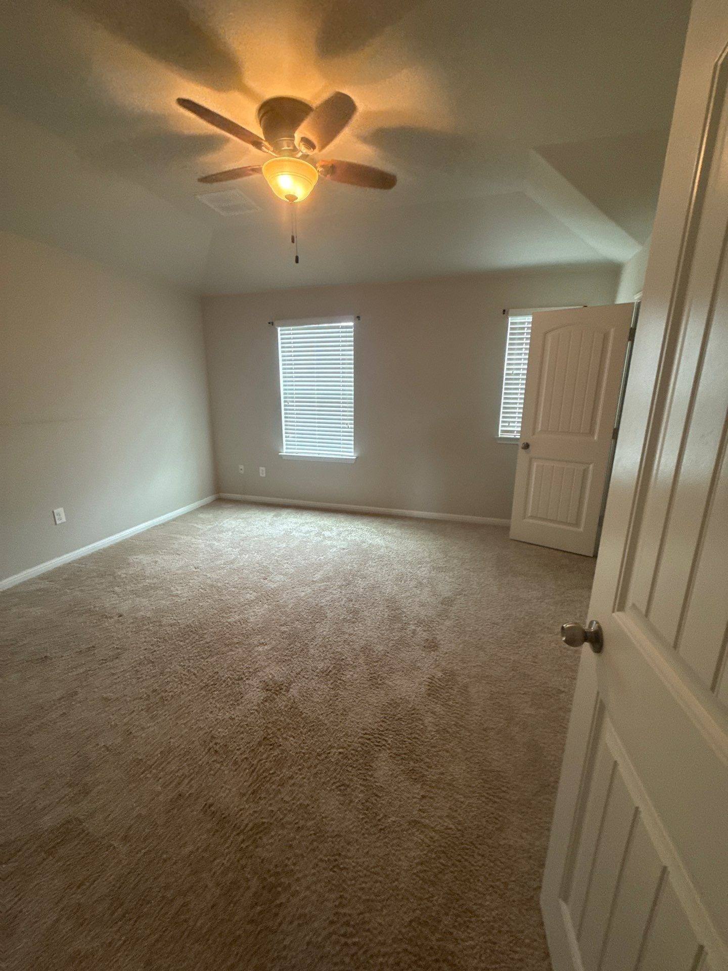Bedroom of a home on Adage Dr in Pflugerville, TX ahead of interior painting by Hill Country Painting