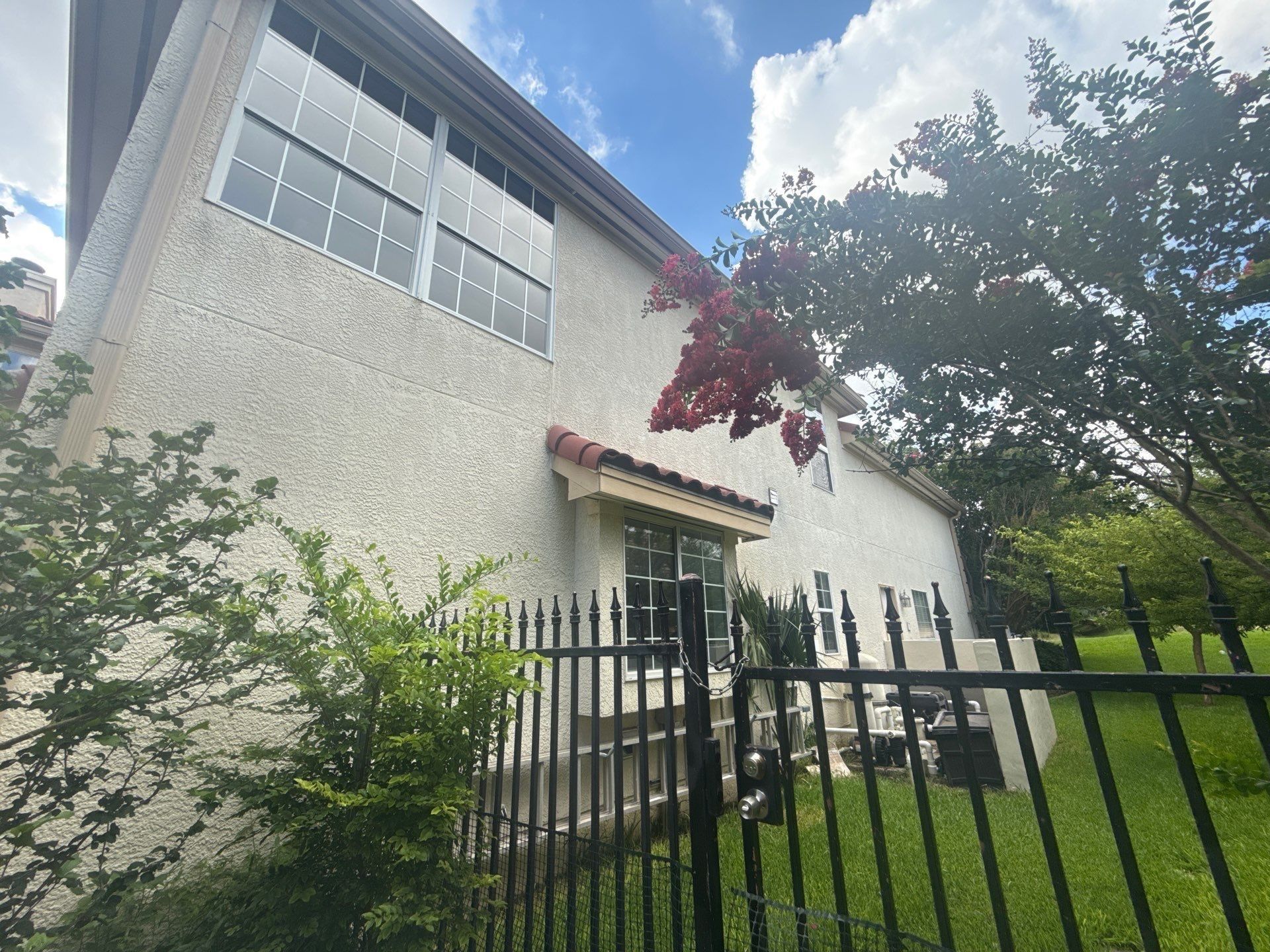 Side exterior of a home on Wingreen Loop in The Hills, TX ahead of exterior painting by Hill Country Painting