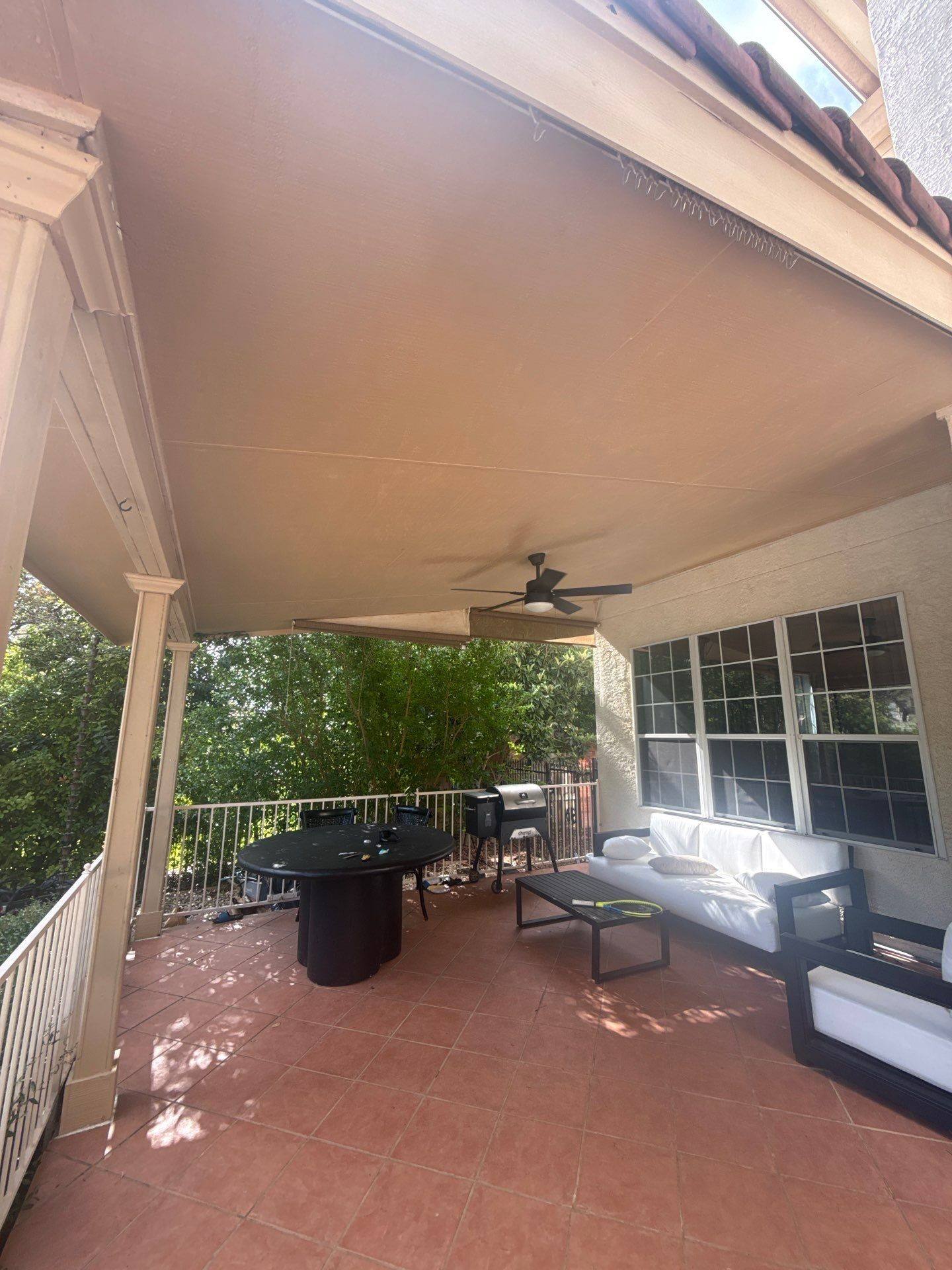 Covered porch ceiling of a home on Wingreen Loop in The Hills, TX ahead of exterior painting by Hill Country Painting